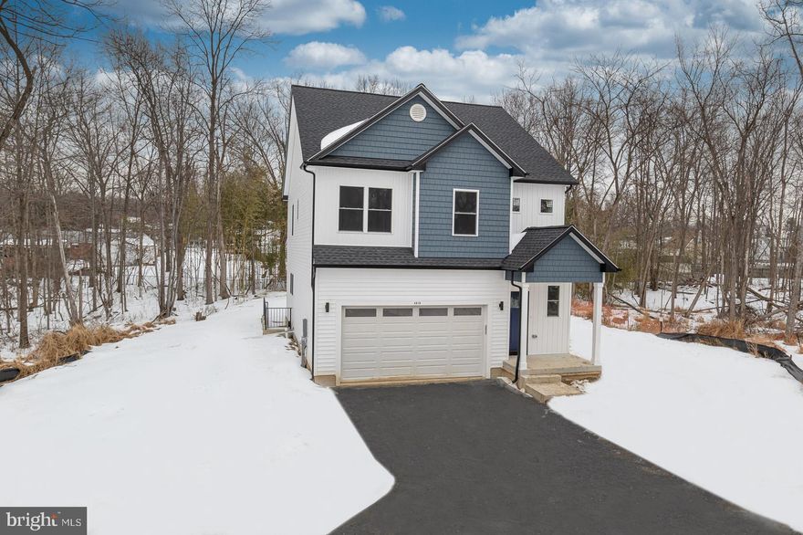 Newly constructed on a 2/3 of an acre wooded lot, this stunning residence is a must-see! Enter a lively modern interior where high ceilings and wood flooring grace the seamlessly flowing layout. Double-hung windows spill abundant sunlight across the living area, highlighting an elegant fireplace with tile surround. Picturesque backdrops adorn the large glass sliders in the dining corner. The immaculate kitchen displays stainless steel appliances, gorgeous shaker-style cabinetry, and quartz countertops extending to the pendant-lit island. Retire upstairs to the well-sized retreats, accommodated by a refreshing shared bath with a shower/tub combo. Double doors reveal the generous primary suite where dual closets and a luxurious ensuite await. A fantastic location means local shops and restaurants are nearby. Come make this gem yours before it’s gone for good! No front foot or HOA fee. Construction is completed except for driveway and grading.