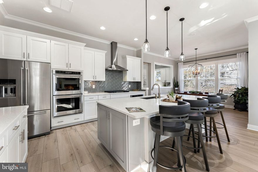 🏡 Welcome to your dream home in the prestigious Willowsford, The Grove community! 
This exquisite residence west-facing boasts unparalleled luxury and functionality at every turn. With Kitchen Aid Appliances, Double Oven, and a Built-in Microwave, culinary excellence awaits in your chef's kitchen, where every detail is designed for both style and convenience. As you explore the main floor, you'll discover a seamless flow from the cozy sitting area to the majestic dining room, leading to the chef's kitchen through the butler pantry – the perfect setting for showcasing your culinary skills and entertaining guests in style.
The main floor also features a beautiful study room and a modern office, complemented by a spacious mudroom for added convenience. Upstairs, four bedrooms and three full bathrooms await, alongside an amazing laundry room for effortless living. 
Descending to the basement, you'll find a haven for entertainment and relaxation, highlighted by a BRAND NEW bar, living space, extra bedroom, full bathroom, and a designated gym area that can easily transform into a home theater. Step outside to the elegant patio with a sitting wall and firepit, providing the perfect backdrop for outdoor gatherings. With access to the basement and ample space for a future pool, the backyard offers endless possibilities for creating lasting memories with loved ones.
Don't miss the opportunity to make this exquisite home yours – schedule your tour today and experience the epitome of luxury living in Willowsford, The Grove! 🌟
House Upgrades
 -Premium Upgraded Kitchen with 2 convection ovens and in-cabinet microwave; gas stove and vent, tile and granite countertops 
 -Custom closets in primary bedroom, 2 x upstairs Bedrooms, and walk-in pantry
 -Premium upgraded primary bedroom  ensuite  with tile and granite with walk-in shower
 -HVAC Humidifier
 -Premium MSI 9-inch vinyl flooring throughout the house
-Screened in porch
- Sound System
 - Slate patio with firepit connecting from walk-down screened porch and walkout basement - 
 -  Inground sprinkler system
 - New custom basement bar, and entertainment center with plenty of game storage and shelves
 - custom workout room/gym