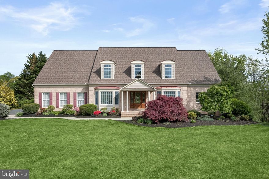 Experience the allure of this remarkable 5-bedroom, 5.5-bath custom home nestled in the prestigious Elliott’s Chance community adjacent to Greystone Golf Course, situated within a quaint community boasting exquisite residences.  Sense of arrival begins with the meticulously landscaped grounds and oversized walkway leading to the gorgeous atrium front door.  Inside, the welcoming 2-story foyer is graced with rich hardwood floors and bathed in natural light, creating an inviting ambiance.  Indulge your culinary desires in the open gourmet eat-in kitchen, complemented by gleaming quartz counters, a center island, stainless steel appliances including a 6-burner Viking cooktop with downdraft, Kitchen Aid double wall oven, GE Monogram refrigerator highlighted by a timeless subway tile backsplash.  Entertain with ease in the spacious family room, with a wood burning brick fireplace, seamlessly connected to the kitchen, fostering an ideal space for gatherings and relaxation. Convenience meets functionality with the spacious combination laundry-entry room conveniently situated off the 3-car garage and kitchen, boasting ample storage from the built-in cabinetry, plus a full bath.  Step outside to the expansive deck adorned with vinyl railing and a bespoke decorative medallion overlooking the lush rear grounds offering a serene outdoor retreat for al fresco dining and leisure.  Step back inside to discover the epitome of luxury living with a first-floor owner's suite, offering a serene sanctuary with a soaring cathedral ceiling, luxury vinyl plank flooring, a private slider out to the deck, walk-in closet with a custom organization system, and en suite bath enriched by a soaking tub, separate ceramic tile surround shower and double sink vanity extending a spa-like experience.    Let the upgraded metal railing and balusters lead you to the upper level boasting of 4 generously sized bedrooms and 2 full baths, each appointed with meticulous attention to detail and comfort, all on a separate zone for personalized climate control. Descend to the lower level, where endless possibilities await in the expansive recreational room area, complemented by a kitchenette with quartz counters, ample storage space, and a full bath. Unleash your creativity in the large workshop/unfinished area, ideal for hobbies or additional storage.  Benefit from the acclaimed Hereford Zone and Blue Ribbon Schools, ensuring exceptional education opportunities for residents. Enjoy the proximity to the NCR Trail, perfect for outdoor enthusiasts seeking adventure and tranquility.  In 2021, notable updates were made to this home, including the installation of a water filtration system and a house dehumidifier. Additionally, improvements were made to the well pump/water pressure system, and the deck was resurfaced. The patio and concrete steps were also refreshed, along with the installation of a new dishwasher and quartz countertops for the second-floor bathrooms, owner's suite bath, and powder room. In 2023, further enhancements were carried out, including the replacement of the roof, the pumping of the septic system, and the installation of a radon mitigation fan system. Continuing the trend of upgrades, in 2024, a new hot water heater was installed. This home also benefits from a current HVAC plan in service, ensuring comfort and efficiency year-round.  Embrace a lifestyle of luxury, comfort, and convenience in this extraordinary custom home, where every detail has been meticulously crafted to exceed expectations. **2.875%  Assumable Mortgage***
Note:  Some interior photos have been virtually staged.