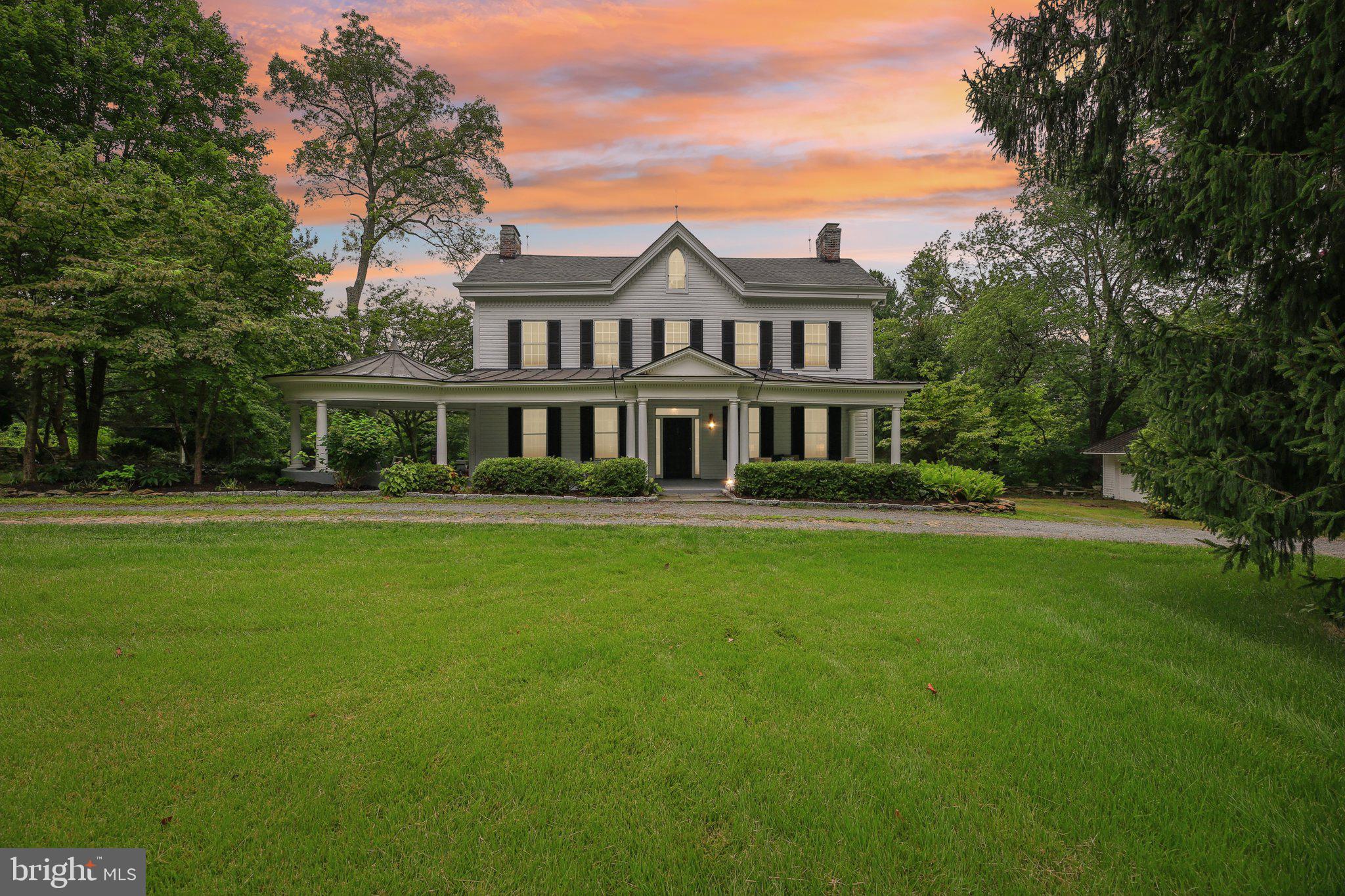 Welcome to a truly exceptional historic estate home where timeless elegance meets modern luxury on over 4 pristine acres in sought-after Parkton, Maryland. This distinguished 6-bedroom, 4.5-bathroom property offers 4,225 finished square feet and showcases the best of both worlds - historic character enhanced by modern reliability. The home has been lovingly refreshed with new paint and features a beautifully remodeled eat-in kitchen perfect for both intimate meals and grand entertaining, while the updated primary bathroom provides a luxurious retreat. Located on the prestigious York Road corridor, this estate offers the perfect sanctuary from city life while maintaining easy access to Baltimore and surrounding areas. Most major systems have been recently upgraded including multiple HVAC systems, dual 200-amp electrical panels, hot water heaters, new generator for backup power, and fully functioning fireplaces that create warmth and ambiance throughout the home. Multiple decks have been recently replaced, providing beautiful outdoor entertaining spaces that seamlessly blend with the home's historic charm. The stunning wraparound front porch serves as the crown jewel of this historic beauty, providing the perfect spot for morning coffee or evening relaxation. The expansive grounds feature a circular driveway providing grand arrival and ample parking, a detached 2-car garage with workshop space ideal for the hobbyist or craftsman, and multiple charming outbuildings offering endless possibilities for storage, hobbies, and so much more. The over 4 acres of mature landscaping, gardens, and open space provide privacy, recreational opportunities, and room to roam, making it perfect for people seeking space and privacy, equestrian enthusiasts, or anyone dreaming of a true country estate lifestyle. This rare offering represents an unparalleled opportunity to own a piece of history that has been thoughtfully updated for today's living. Every corner of this historic estate whispers tales of yesteryear while embracing modern convenience and reliability. From the remodeled kitchen to the upgraded systems, from the functioning fireplaces to the luxurious primary bathroom, this home offers countless opportunities to create lasting memories while enjoying complete peace of mind. Schedule your private tour today and step into a lifestyle where history meets luxury, and every day feels like a retreat to the countryside where the possibilities are truly endless.