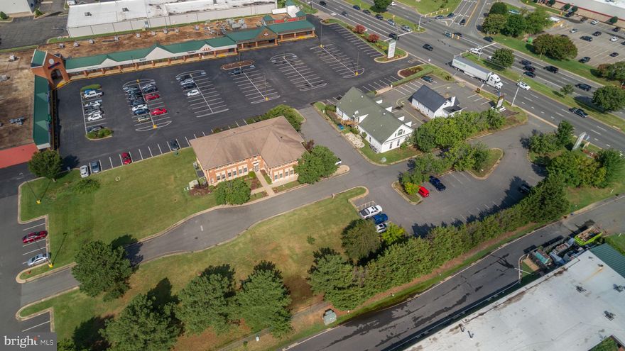 Priced BELOW ASSESSED VALUE! Introducing Wendhurst Commons, a prime investment opportunity located at 3920 Plank Road in the heart of Fredericksburg’s thriving commercial corridor. This 8,652-square-foot office building, constructed in 2000, is positioned just off the busy Route 3 corridor and minutes from I-95, providing tenants and clients with exceptional accessibility in one of the region’s most dynamic and rapidly growing markets.

Wendhurst Commons is strategically located next to Texas Roadhouse, directly across from BJ’s Wholesale Club, and sits near a four-way signalized intersection, ensuring ease of access and prominent visibility for tenants and visitors alike. The property features well-positioned signage along Route 3, capturing the steady stream of daily traffic and maximizing exposure for the businesses within.

The building is thoughtfully designed with six separate office suites, three on each floor, complemented by common area men’s and women’s restrooms on both levels, providing functionality and comfort for a variety of professional tenants. Zoned C-2, Wendhurst Commons supports a wide range of office and commercial uses, aligning seamlessly with the area’s growth and the demand for high-quality professional space.

Its location within Fredericksburg’s main commercial artery, coupled with surrounding retail and dining anchors, further enhances the desirability and strength of this asset.

An additional adjacent 1.12-acre parcel is also available for purchase, creating potential for future expansion, added parking, or redevelopment opportunities to further enhance the investment potential of Wendhurst Commons. This combination of location, visibility, and upside positions Wendhurst Commons as an outstanding investment for those seeking a high-performing, strategically located asset in Fredericksburg’s expanding market.