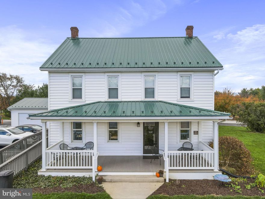 The original farmhouse (2372 sq foot) is 100 years old  and has been updated to add a commercial kitchen, 2 commercial handicap bathrooms and a restaurant on the first floor. The upper level holds office rooms, 2
bathrooms, a break room and storage.   The farmhouse is  heated and cooled with two heat pump units.  The garage contains 2 additional storage areas and 2 car garage/storage area.  The digital sign also conveys with the property.  The neighboring commercial property (the Barn)  is also for sale and available as a package deal if desired!  It is listed under MLS # MDWA2023214.