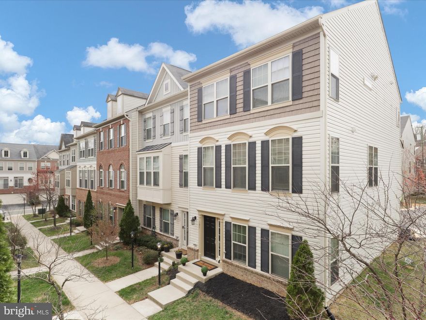 This stunning, sun-filled end-unit craftsman townhome in Occoquan Heights offers a spacious and open layout with fresh updates throughout.  Enjoy an expansive living/dining area with tall ceilings, new hardwood floors (2024), and fresh paint. The gourmet eat-in kitchen offers an oversized island, granite countertops, 42” cabinets, stainless steel appliances, and a bright bump-out with a sliding glass door. The upper level features a vaulted-ceiling primary suite with a walk-in closet and a luxurious en suite bath with a soaking tub, shower, and double vanity. Two additional bedrooms, a hall bath, and a convenient upper-level laundry complete the space. There is also a bonus lower level bedroom or office with an en suite bath, a welcoming foyer with easy-to-clean ceramic tile floors, and ample storage. Additional highlights include a two-car garage with an EV charger, a charming front courtyard, and a prime location within walking distance to historic Occoquan, a great place to experience shops, dining, nature, and parks! Fabulous location with the VRE and major commuter routes nearby.