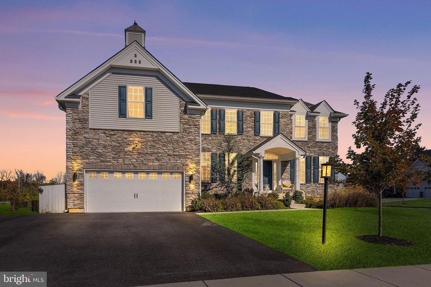 Looking for newer construction in an established neighborhood? Come experience this marvelous 2021 build in Malvern. Located within the Reserve at Great Valley, 10 Unison Dr is an exceptional five-bedroom, four-bath residence that delivers over 5,000 square feet of sun-drenched, impeccably designed living space. This home is enhanced by significant builder upgrades throughout, including a premium, extra-deep basement with nine-foot ceilings. Inside, discover a grand, light-filled foyer that welcomes you and flows seamlessly into an expansive open-concept living area designed for both everyday comfort and elevated entertainment. The focal point of the home is the custom gourmet chef’s kitchen, thoughtfully designed with a massive center island, U-shaped wraparound counters, and a full suite of stainless steel appliances, including double ovens and a gas range with hood. The gorgeous 42-inch soft-close cabinets provide excellent storage along with a sizable walk-in pantry. An abundance of windows floods this space with exceptional natural light, making the kitchen both functional and visually stunning. The adjoining great room impresses with dramatic 20-foot ceilings, a sleek gas fireplace, and a built-in bar, creating an ideal setting for hosting or relaxing in style. The dining area continues the sense of sophistication with a tray ceiling and a statement chandelier that anchors the space beautifully. A full bath and a versatile flex room with a closet complete the main level, offering the perfect setup for a guest suite or private home office. Upstairs, the primary suite serves as a true retreat, featuring a separate sitting area ideal for a nursery, den, or private lounge, along with two large walk-in closets. The spa-inspired primary bath includes dual vanities, a deep soaking tub, and an oversized walk-in shower. Three additional spacious bedrooms—one with its own ensuite bath—are joined by a central loft space and a convenient second-floor laundry room. The finished lower level further expands the home’s living space, highlighted by nine-foot ceilings, a versatile recreation area, a dedicated home gym zone, and ample storage space to meet a variety of lifestyle needs. Outside, pull into the spacious driveway, complemented by a two-car garage and an additional pad that comfortably accommodates multiple vehicles. The outdoor living area is equally impressive, with a professionally landscaped and fully-fenced yard that frames a 900-square-foot Trex deck topped with a premium pergola. This private, green setting provides an ideal backdrop for effortless alfresco dining, entertaining, or quiet relaxation. This community also features a mile-long trail and fully sidewalked streets. Located within the award-winning Great Valley School District, just minutes from premier shopping, dining, and major commuter routes, this home offers turnkey perfection in one of Chester County’s most sought-after enclaves. Schedule your private showing today—and bring your best offer! First showings to begin Saturday, 3/7.
