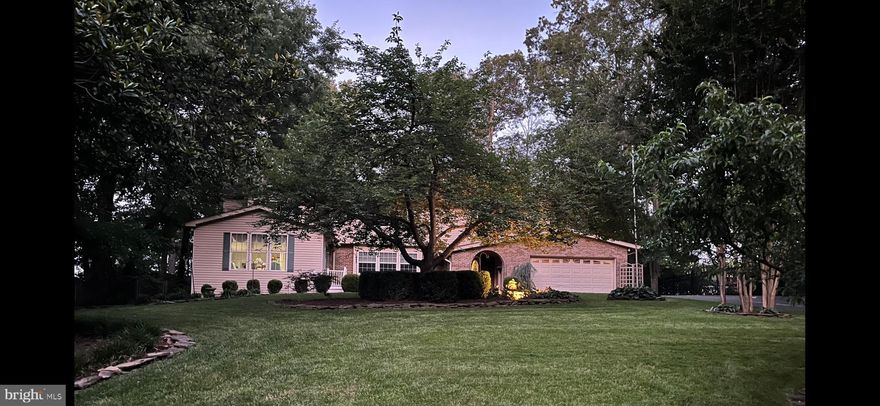 No HOA!!Unique & Individual Architecturally Designed 3-Level, 5 bedroom  Main House w/Attached 2-Story Separate Residence/In-Law Suite on a half acre with Quantico Creek Water views,  4 Fireplaces.   2 All Season Sunrooms/Patio w/French Doors.  In-Law Suite Handicap accessible,  Huge Kitchen Island w/Electrical Outlets (including Chairs), Seats 8.    Stainless Steel Kitchen Appliances:   New Frigidaire Side by Side Refrigerator,  LG Self-Cleaning Double Oven,  New LG Dishwasher,  New Built-In Trashcan.    Arched Windows in Formal Living Room.    Hardwood Floors. Safe Home Security system, Energy Efficient windows,  Trey Ceilings.   Crown Molding.   Recessed Lighting.   10 Ceiling Fans.   Huge Primary Bedroom w/Walk-In Closet.   “Clawfoot” Bathtub.   Granite & Marble Walk-in/Seated Shower.   Granite Countertop Double Sinks w/2 Chandeliers & Granite Vanity in Primary Bath.   New Carpet & Paint.   Finished Walk-Out Basement.   Large Laundry Room w/Laundry Chute.   Navien Tankless High Efficiency Water Heater.   New Washer & Dryer.   Office/Exercise Room.   Billiards Room w/Wet Bar, Sink, Mini-Fridge, Pool Table w/Ping Pong Table Top.   Lighted, Heated Inground Pool w/Fountains.   Brick Pool House w/Pool Supplies.   2 Outdoor Barn Sheds.   Manicured Yard w/Mature Trees.   Underground Water Sprinkler System.   2 Fenced Dog Run Areas.   2 Car Garage.   New Chamberlain Garage Door Opener.   8 Car Capacity Driveway.       
In-Law Suite Addition:   Separate Entrance.      Hardwood Floors & Carpeting.   Living Room w/Fireplace.   Kitchenette w/Upgraded Granite Countertops & Matching Table & Chairs.   Refrigerator.   Dishwasher.   Handicap Bathroom w/Upgraded Granite Countertops & Vanity,  Walk-In/Handicapped Shower.   Lower-Level Bedroom.   Ceiling Fans.   2nd Washer & New Dryer.   Upstairs Large Bonus Room/Bedroom w/Private Balcony.  Lighted Heated Inground Pool(have pool inspection reports for the last 10 years)Widened Wheelchair-Accessible Doorways.   Wheelchair Ramp in Shed/Storage.   near Route 1, I95 and Quantico Marine Base/FBI Academy. Also close to John Paul the Great Private School.
 Other amenities, too numerous to list. Hot Tub as-is.