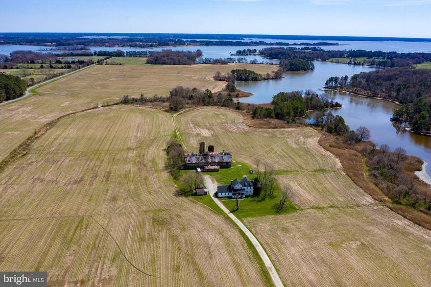 1 mile of waterfront on Davis Creek (5' MLW).  273 Total Acres - 190 tillable acres, 60 wooded acres.  Large home currently used as hunting lodge.  Excellent hunting.  Subject to current farm lease.