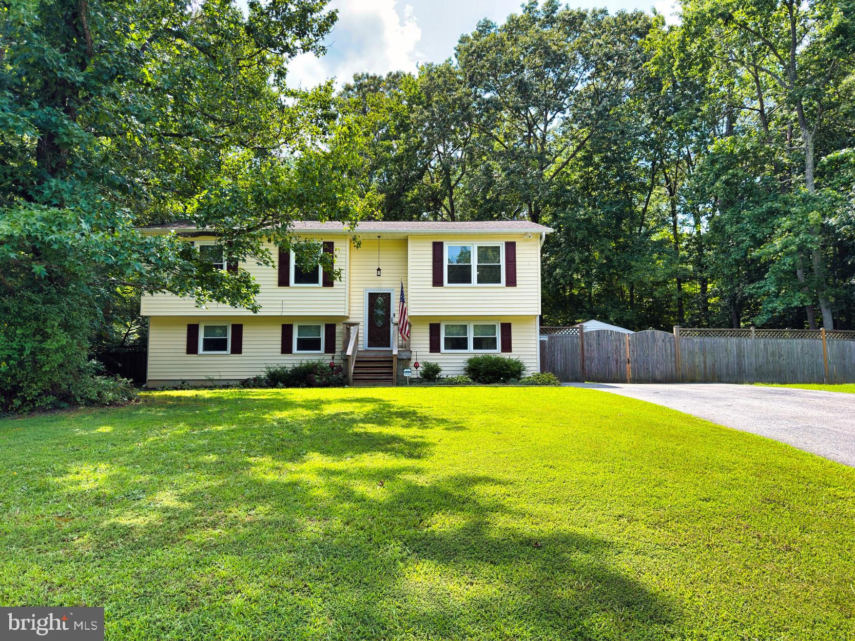 Just listed in the Country Lakes Subdivision of Mechanicsville! Pride of ownership is evident in this meticulously maintained 4 bedroom 2 bath Split Foyer which features approximately 1,900 above grade living square footage and is situated on a one acre wooded lot. The entire interior of this home was just recently painted a neutral palette & the HVAC system is approximately 3 years old. Enter the home through the front foyer and on the upper level of this home you will find a large living room (currently set up by the seller as the dining area for large family gatherings). A large kitchen with eat in area, center island and a bonus computer work station area is situated off of the living room. The kitchen is equipped with large oak cabinetry, newer stainless steel appliances, additional built in pantry cabinetry and has an abundance of counter space for meal preparation. Off the kitchen slider there's a deck which overlooks the rear level fenced in yard, 2 storage sheds and a covered deck on the ground level which makes a great area for cookouts, entertaining and eating MD steamed crabs! Three bedrooms and a full bathroom complete the main level of the home. The lower level of this home is above ground level and has a slider which exits to the rear yard. A new pellet stove in the cozy family room conveys with the sale and adds a complimentary heating source on those occasional cold nights. Down the hallway there's a large fourth bedroom which has a walk in closet. Across from the bedroom is a large second full bathroom equipped with a large walk in tiled shower with tiled bench seat and a large vanity with a granite top. A large cedar lined closet, additional walk in closet as well as a utility room with laundry complete the lower level of the home. This home is conveniently located and within approximately 30 minutes from Waldorf, Lexington park- Pax River Naval Station, Solomon's Island and Dahlgren, VA- NSWC. This home conveys with a one year Cinch Home Warranty and a transferrable window warranty.
