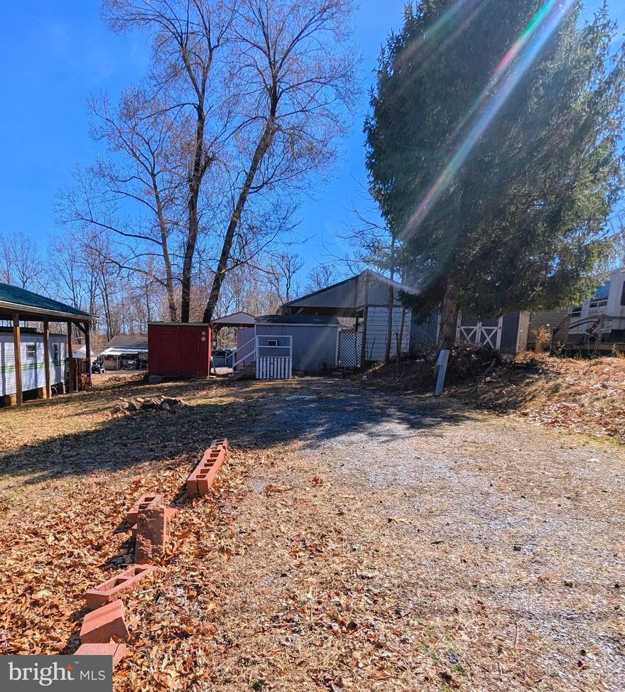 "Level Lot with Sewer Hookup" close to amenities. Bring your camper and start enjoying the river life! This flat lot features a sewer hookup and is within walking distance of the pool, playground, camp store, mini-golf, and more. The shed has great potential and just needs a bit of care to bring out its best features.  Don't miss this great opportunity to make it your own!

** WELCOME TO RIVER BEND/SEASONAL LOT AVAILABLE TURN KEY** River Bend is a privately owned 400 acres recreational- vehicle camp resort with seasonal activities for members, families and guests. This great RV park is tucked away on the Upper Potomac River of West Virginia, River Bend is one of West Virginia's most popular family seasonal destinations. . Just a short drive from the Washington and Baltimore metro area. Open with utilities from April 1 to November 1. Lot owners have access to their property the entire year. *** Members Enjoy *** * Amazing views and wildlife, Potomac River access, Trails, Swimming pools, Mini-Golf, Youth center, Tennis and basketball courts, laundry facilities, convenience store, deli and lounge. *Bath houses throughout the park, boat ramp, bar and grill and even a church located on the grounds. River Bend also hosts numerous activities such as 4th of July fireworks, small carnival, bonfires, poker runs, horseshoe tournaments, car show, Halloween Trick or Treat and so much more.