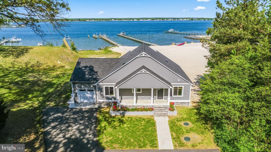 Experience this waterfront vacation lifestyle at HOME in Saint Mary's County, Maryland!  Extraordinary Patuxent River waterfront home on 1.27 breathtaking acres with panoramic views stretching directly across to the Solomons Island boardwalk.  Rarely does a property offer this level of lifestyle coupled with so many brand-new modern upgrades! Completed with an expansive sandy beach, private pier, and a beautifully new renovated home designed to capture the very best of waterfront living.  Conveniently located close to schools, shopping, restaurants, NAS Patuxent River, Solomons Island and more! 
This stunning 4-bedroom, 3-full-bath home has been completely remodeled with high-end custom finishes throughout. In 2020, the home was transformed to include all new paint, flooring, 3 brand new bathrooms and an exceptional chef’s kitchen featuring a massive center island, custom cabinetry, gorgeous quartz countertops. That same year, an upper floor was added to create a truly spectacular 690-square-foot owner’s suite, offering a luxurious private retreat with an elegant, tiled bathroom boasting a dual quartz topped vanity, a custom walk-in closet and upstairs laundry. The main level is also thoughtfully designed for both comfort and entertainment in mind with the gorgeous kitchen opening to the family room, the exterior deck, huge white sandy beach and wide-open water views. Three additional bedrooms are located on the main level, including one with a private en-suite bathroom, while the third full bathroom serves two secondary bedrooms. The main floor laundry closet adds to everyone's convenience. The HVAC is approximately 3 years old. The large crawl space was recently professionally encapsulated and features a tankless water heater.  Step outside and experience the true magic of this property. The inviting huge white sandy beach is an uncommon treasure in Southern Maryland, and the private pier is equally impressive with a 10,000-pound boat lift, two jet ski lifts, and a spacious seating area made for unwinding and enjoying unforgettable views of both the water and the iconic Solomons Island and bridge. Don’t miss this opportunity because waterfront living simply does not get better than this!