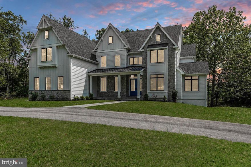 Grand Manor Home only 2 Years Old on 3.1 Acres in a Beautiful Country Setting in Desirable Malvern. This Magnificent Residence is located on a Cul De Sac Lane and Exudes Luxury and Comfort with Ultra High End Finishes and Appliances and expensive Custom Fixtures. Featuring 10 foot ceilings on the first floor and 9 foot ceilings on the second floor, 5 bedrooms, 5 bathrooms, and 2 powder rooms, oversize 3 car garage, walk out finished basement, and an elevator from the basement to the second floor. On site finished hardwood floors, first floor office, cool living room parlor with beverage bar, two story center hall, luxurious gourmet kitchen, spacious breakfast room with cathedral ceiling and slider to the deck with gorgeous views, elegant formal dining room, and the  custom features butler pantry. The rear mud room with custom cubby shelves leads to the large walk in pantry and a second powder room. The Primary Suite features a vaulted ceiling, and a breathtaking Primary Bathroom. All of the walk in closets have custom built ins, and there's a convenient and large second floor laundry room. All of the bathrooms include custom tile and fixtures. The walk out finished basement features a large recreation room with a beverage bar, a fitness room (or dance studio), a custom bathroom with a steam shower, and a hidden gamer's room behind the built in bookshelf.  There's also a second stairway from the basement that leads to the garage.  The expansive grounds are mostly level, include plenty of room for a future pool, and has a private wooded back drop. Very convenient location in Willistown Township with the Award Winning and Highly Desirable Great Valley School District. Welcome Home to Many Years of Happy Memories !