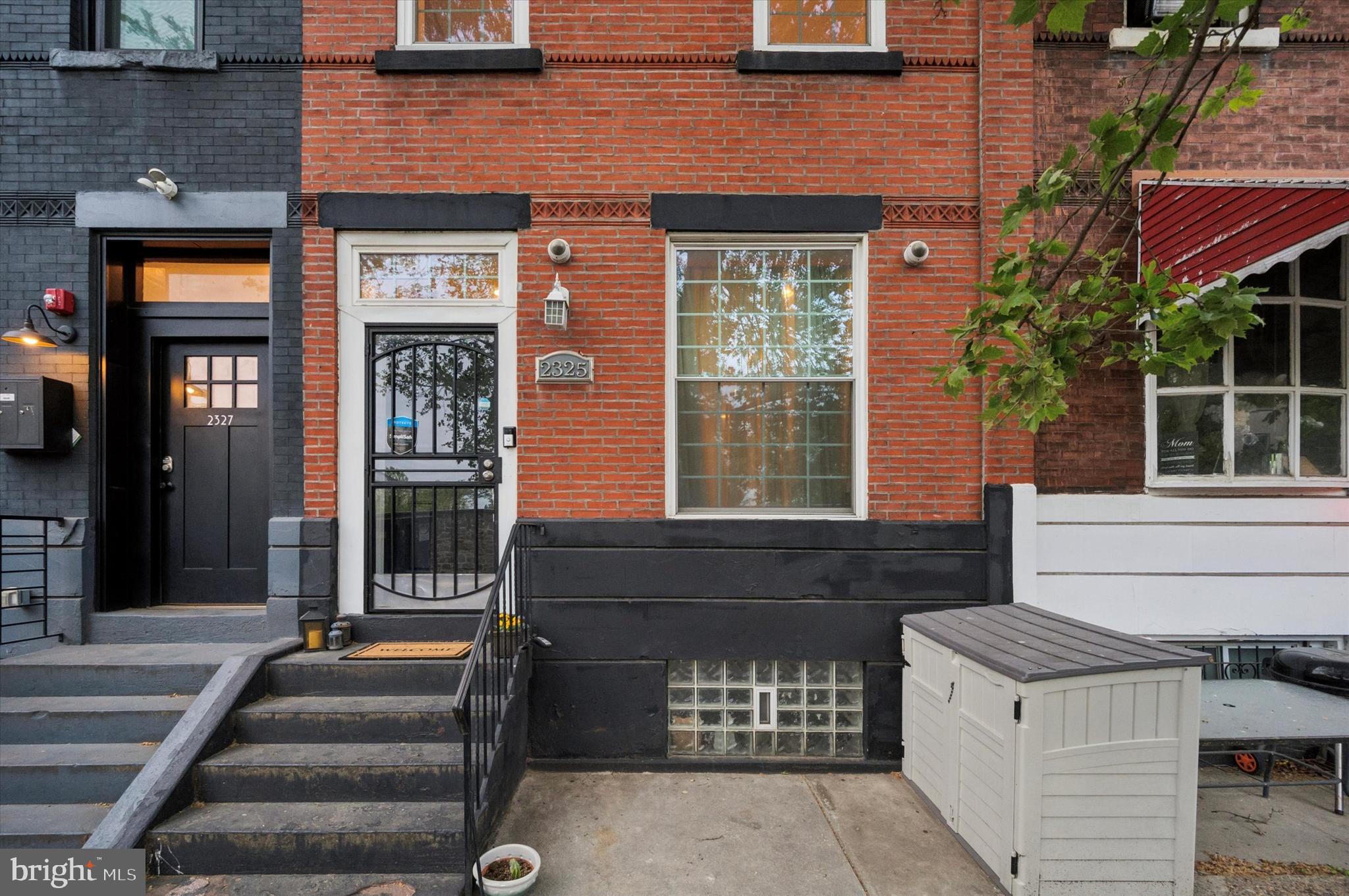 Recently renovated and full of modern upgrades, 2325 N College Ave is a spacious 5-bedroom, 4.5-bath home nestled in the vibrant Girard College section of Philadelphia. The open-concept main level features a stylish living and dining area that flows into a sleek kitchen with stainless steel appliances and granite countertops. Exit from the dining room to a paved rear yard offers a private, low-maintenance outdoor space. The first floor also includes a bedroom and full bathroom, ideal for guests or flexible living. Upstairs, you’ll find four additional bedrooms and three full bathrooms, with the third floor dedicated to a private primary suite complete with an ensuite bath and a convenient laundry closet. From the upper level, step out onto a stunning bi-level roof deck boasting panoramic views of Girard College and the Center City skyline. The basement adds extra functionality with ample storage and a powder room. Additional highlights include hardwood floors throughout, exposed brick accents, and central air. Located just steps from Brewerytown’s popular amenities, local dining, and public transit, this home offers the perfect blend of space, style, and city convenience. Don’t miss your chance to own this beautifully updated home in one of Philadelphia’s most exciting neighborhoods—schedule your tour today!
