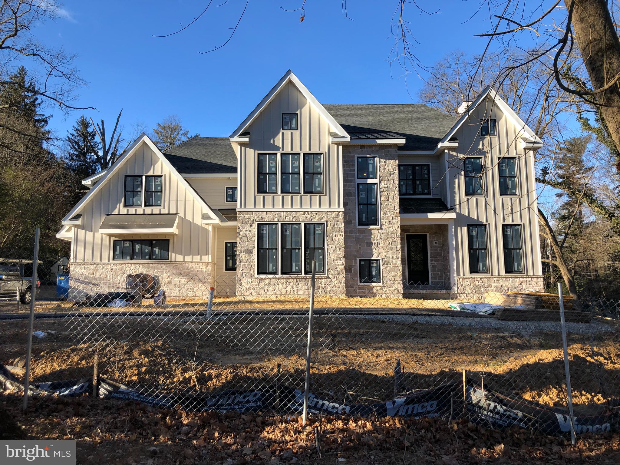 No for sale sign on Property. This new construction is on corner of Harrison & Parkes Run Lane ! Tucked away behind heritage trees, a Villanova new construction in an established neighborhood ...One of two exciting new Construction homes. Enjoy the ability to live with all new systems, no need to worry about upkeep maintenance expenses. Home #1 - 730 Harrison exterior will feature custom black windows, black iron doors with laid sandstone and cobblestone color hardiplank exteriors. The inviting floor plan with fabulous french white oak floors creates a farmhouse feel with chic vibe. From the foyer you can either enter a study/living space or ascend the stair tower to the second floor. The formal dining room has a serving butler station with sink and leads to the chef's kitchen with wolf commercial appliances, solid custom wood cabinetry, a china wall cabinet, and open shelves with subzero refrig/freezer including a wine tower and a waterfall style island countertop. To the rear of the kitchen sits the informal powder room, a large kitchen pantry closet, cloak closet and room for a office desk/ cubbies hallway to the screened porch via dutch door. The morning room off the kitchen offers iron french door access to a screened in 3 season Vernon Hill patio as well as french iron door entry to the fire pit. The large family gathering area embraces breakaway doors extending the inside to the outside with covered patio & fire pit. Choose to stay inside and enjoy the warm finishes complete with wood or gas burning fireplace and built in TV station. The second floor features a master bedroom with a reading nook set off by a rustic beam and shiplap walls. The ample closet space and a master bath with make up vanity completes the owner space. The second floor retreat creates a cozy nook for homework, a kids schooling area or just a lazy retreat while the remainder of the floor includes a large built in laundry room, 4 additional bedrooms with bath and out of season closet. The basement level offers daylight and a large playroom and wine closet, and ample storage or area for other uses. The lot can fit a pool if so desired. Current structure in the rear will be demolished. Customization is available now. Call for more information regarding specs, add on pricing, etc. Take a look at 753 Newtown Road, Villanova for finish levels.