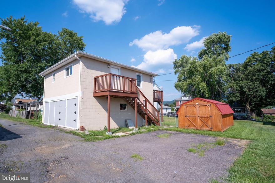 Charming Apartment Over Spacious Garage! Discover this unique opportunity in a convenient Cumberland location! This one-bedroom apartment sits above a versatile lower level that includes garage and storage space. The upstairs living area features a bright kitchen, a living room, spacious bedroom with a large closet, and a full bathroom. Step out onto the private deck just off the living room — perfect for entertaining. Downstairs, you'll find ample room for storage or a potential workshop, along with a laundry area and a separate utility room housing the boiler and hot water tank. Set on a generous, level lot, the property also includes a parking pad for 2–3 vehicles and a handy storage shed. Just minutes from Allegany College, UPMC Western Maryland, and I-68 — this property is ideal for an owner-occupant, student, or investor!