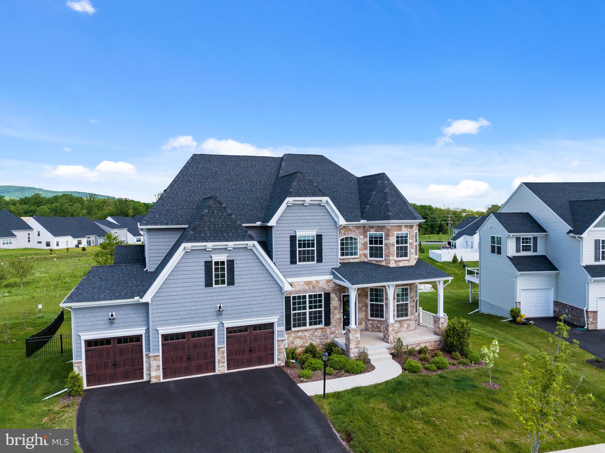Rarely available in the highly sought after Kellerton Community, this exquisite 6-bedroom, 5.5-bath luxury home, built in 2022, boasts exceptional design and premium upgrades throughout. Featuring a 3-car attached garage, a grand double staircase, and a heated in-ground saltwater pool, this residence offers a resort-style living experience.
Upon entry, you'll be greeted by stunning LVP flooring, soaring cathedral ceilings, a cozy gas fireplace, and an abundance of natural light, creating a warm and inviting atmosphere. Perfect for entertaining, this home is truly a dream. The fully fenced backyard offers serene views of a creek, planted reforestation buffer, and open space against the backdrop of Catoctin Mountain, providing a beautiful oasis and perfect for enjoying outdoor space and scenery.
The gourmet kitchen is a chef’s dream, with a large farmhouse sink, gleaming quartz countertops, a large center island, double ovens, and cabinetry that extends to the ceiling for ample storage. The kitchen also features a full-sized Frigidaire Electrolux refrigerator and freezer with custom trim, along with a fully vented range hood. A dedicated prep kitchen with a second full sink provides additional space for entertaining, for a coffee bar, has custom wine storage, and extra cabinetry. The walk-in pantry offers even more storage for all your culinary needs. Dual staircases offer convenient access to both the kitchen and main living areas.
The open dining area is perfect for hosting, and a versatile bedroom with a full bathroom on the main level can easily be transformed into an office, playroom, or gym offering endless possibilities. Upstairs, you'll find four generously sized bedrooms, each with spacious closets, including a luxurious primary suite with a spa-like en suite bathroom. The primary bath features a luxurious soaking tub, dual vanities, and an oversized rainfall shower with triple shower heads and wall jets. A convenient laundry room is also located on the bedroom level along with 3 full bathrooms.
The expansive finished walk-out basement includes an additional bedroom and bathroom, and opens up to the patio and stunning heated in-ground saltwater pool (installed in 2024). The patio also features a custom built in fire pit and the composite deck with vinyl railings is perfect for hosting parties with picturesque views. The lower level also includes an unfinished section, perfect for storing holiday decorations and other items.
Nestled in a picturesque neighborhood, this home offers a wealth of amenities, including a dog park, walking paths, an in ground community pool, clubhouse, fitness center, dog wash station, meeting rooms, basketball courts, and tot lots. It’s just minutes from downtown Frederick, where you can enjoy a variety of restaurants, parks, library, coffee shops, art galleries, and so much more. The Marc train is minutes away and easy access to commuter routes to DC, Baltimore, and Virginia.
This home truly has it all. Schedule your tour today!