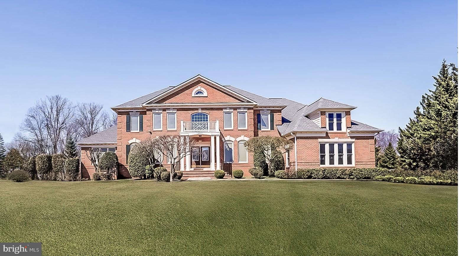 Escape to a country club lifestyle in this extraordinary 6-bedroom, 5-bath, 3-car garage sanctuary that redefines luxury living. Thoughtfully designed to blend masterful comfort with elegance, this 9,000+ square-foot residence is nestled in the prestigious golf course community of Hampshire Greens in the heart of Ashton. Experience the perfect balance of privacy and accessibility, with premier dining, shopping, parks, hiking trails, and major commuter routes to Washington, D.C., Columbia, and Baltimore just moments away.
As you step inside, an elegant foyer welcomes you. To the left, a formal living room adorned with crown molding and large windows fills the space with natural morning light. This room extends seamlessly into a spacious conservatory, perfect for hosting overflow guests or enjoying a private retreat during the daily routine.
To the right of the foyer lies the formal dining room, highlighted by a dazzling crystal chandelier and direct access to the gourmet kitchen via a butler’s pantry—ideal for effortless entertaining. The foyer leads to the centerpiece of this home: a grand 2-story family room with a gas fireplace, built-in entertainment center, and expansive floor-to-ceiling windows overlooking the serene, tree-lined backyard.
The adjoining home office, featuring built-in bookcases and crown molding, offers a sophisticated space for work or study. At the heart of this level is the gourmet kitchen, equipped with an extra-large central island, newly installed quartz countertops, updated stainless steel appliances, a walk-in pantry, a second pantry, and a cozy breakfast area. Both the family room and breakfast area open onto an expansive deck that stretches across the back of the home—perfect for enjoying the tranquility and privacy of the wooded lot.
For added convenience, the main level also features a full bath and a laundry room. Need a main-level bedroom? The versatility of this home allows for the office, conservatory, and the adjacent renovated full bath to be combined to create a spacious main-level suite.
Access the upper level via two staircases—one in the foyer and another near the kitchen—or use the elevator installed in 2020. The grand primary suite serves as a true sanctuary, offering a lighted tray ceiling, Casablanca fan, a cozy sitting area, his-and-her walk-in closets, and a beautifully renovated ensuite bath (2022) with dual vanities, a soaking tub, and a separate spa shower. Three additional large bedrooms and two updated full baths complete this level, providing ample space for family members or guests.
The fully finished, walk-out lower level is a versatile space with laminate flooring (installed in 2018). This level features an expansive recreation area, a large exercise space, two guest suites, full bath, and a convenient nook perfect for a kitchenette or a wet bar. A spacious storage area ensures ample room for your belongings. This level opens directly to the beautiful rear yard with access to the deck, making it a perfect extension for entertaining.
This home is filled with natural light thoughtfully built by premier custom builder Renaissance and designed for sophisticated living and entertainment. Its exceptional craftsmanship has been meticulously maintained since the beginning, making it a standout example of luxury living in Hampshire Greens.
This extraordinary home awaits its next discerning homeowner. Experience the perfect blend of luxury, comfort, and convenience—your country club lifestyle begins here.
The roof, water heater, and most windows have been replaced since 2017, and the three-zone HVAC system has been replaced since 2013. The home’s exterior and interior have been repainted since 2021.