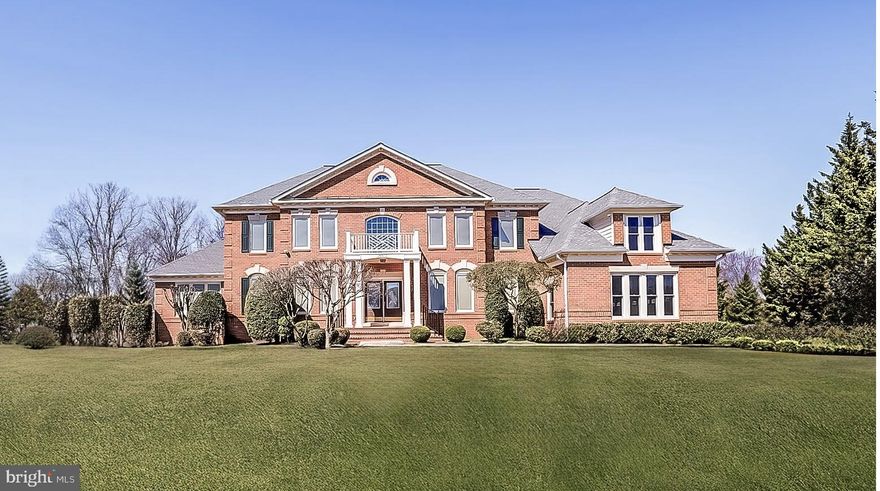 Escape to a country club lifestyle in this extraordinary 6-bedroom, 5-bath, 3-car garage sanctuary that redefines luxury living. Thoughtfully designed to blend masterful comfort with elegance, this 9,000+ square-foot residence is nestled in the prestigious golf course community of Hampshire Greens in the heart of Ashton. Experience the perfect balance of privacy and accessibility, with premier dining, shopping, parks, hiking trails, and major commuter routes to Washington, D.C., Columbia, and Baltimore just moments away.

As you step inside, an elegant foyer welcomes you. To the left, a formal living room adorned with crown molding and large windows fills the space with natural morning light. This room extends seamlessly into a spacious conservatory, perfect for hosting overflow guests or enjoying a private retreat during the daily routine.

To the right of the foyer lies the formal dining room, highlighted by a dazzling crystal chandelier and direct access to the gourmet kitchen via a butler’s pantry—ideal for effortless entertaining. The foyer leads to the centerpiece of this home: a grand 2-story family room with a gas fireplace, built-in entertainment center, and expansive floor-to-ceiling windows overlooking the serene, tree-lined backyard.

The adjoining home office, featuring built-in bookcases and crown molding, offers a sophisticated space for work or study. At the heart of this level is the gourmet kitchen, equipped with an extra-large central island, newly installed quartz countertops, updated stainless steel appliances, a walk-in pantry, a second pantry, and a cozy breakfast area. Both the family room and breakfast area open onto an expansive deck that stretches across the back of the home—perfect for enjoying the tranquility and privacy of the wooded lot.
For added convenience, the main level also features a full bath and a laundry room. Need a main-level bedroom? The versatility of this home allows for the office, conservatory, and the adjacent renovated full bath to be combined to create a spacious main-level suite.

Access the upper level via two staircases—one in the foyer and another near the kitchen—or use the elevator installed in 2020. The grand primary suite serves as a true sanctuary, offering a lighted tray ceiling, Casablanca fan, a cozy sitting area, his-and-her walk-in closets, and a beautifully renovated ensuite bath (2022) with dual vanities, a soaking tub, and a separate spa shower. Three additional large bedrooms and two updated full baths complete this level, providing ample space for family members or guests.

The fully finished, walk-out lower level is a versatile space with laminate flooring (installed in 2018). This level features an expansive recreation area, a large exercise space, two guest suites, full bath, and a convenient nook perfect for a kitchenette or a wet bar. A spacious storage area ensures ample room for your belongings. This level opens directly to the beautiful rear yard with access to the deck, making it a perfect extension for entertaining.

This home is filled with natural light thoughtfully built by premier custom builder Renaissance and designed for sophisticated living and entertainment. Its exceptional craftsmanship has been meticulously maintained since the beginning, making it a standout example of luxury living in Hampshire Greens.

This extraordinary home awaits its next discerning homeowner. Experience the perfect blend of luxury, comfort, and convenience—your country club lifestyle begins here.

The roof, water heater, and most windows have been replaced since 2017, and the three-zone HVAC system has been replaced since 2013. The home’s exterior and interior have been repainted since 2021.