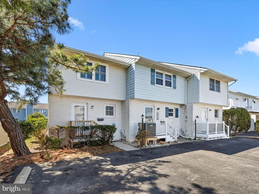 Here it is! A fee-simple townhouse on the canal with NO HOA or Condo dues! Also so close to the beach, just a few blocks off Coastal Highway on 94th street in north OC! This 2 bedroom, 2 1/2 bath 2-story townhouse offers a slip for your boat right out your back door! Enter in your front door to a pleasing open floor plan. The downstairs offers a spacious kitchen with eat-in dining, separate dining area, 1/2 bath, storage closet under the stairs, wet bar area, fireplace, and living room overlooking the water. The back deck offers maintenance free composite decking and is large enough for outdoor dining and relaxation with canal views and ample shade for those warm sunny summer days. Upstairs you'll find a full sized washer/dryer closet with additional storage space and a full bath in the hall for the second bedroom.  The primary bedroom on the canal side offers it's own slider to an outside deck and a nicely updated primary full bath with custom tile walk in shower! Upstairs bedrooms offer plantation shutters on the windows/slider. The paved parking offers 2 spaces per unit, unassigned. The new owner of this townhouse will enjoy a brand new HVAC system installed by Arctic that comes with a transferrable 10 year warranty, additionally, all new water shut off valves have been installed in '25. Sold furnished. The townhouse is located in walking distance to the OC Art League, dog park, grocery store and many popular restaurants! Put this on your list of "must-see quick" beach properties!