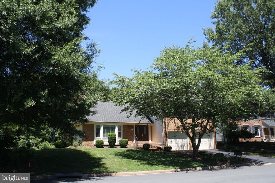 Spacious, Open Floor Plan. Large Rooms Throughout. Large Eat-In Gourmet Kitchen. Hardwood Floors Main & Upper Level. Brick Fireplace. Custom Deck Overlooking Secluded Wooded Common Area. Fully Finished Basement w/ 2 Bedrooms, a Full Kitchen, Family Room, Full Bath & Washer/Dryer. New Windows.