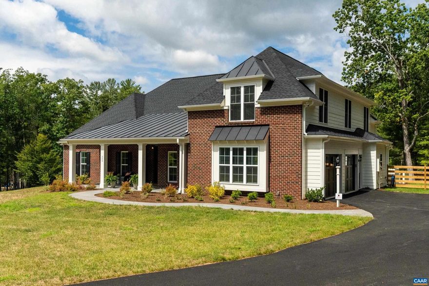 Set on a tranquil five-acre parcel just minutes from Keswick Hall and less than 15 minutes to downtown Charlottesville, this like-new home combines refined design with thoughtful upgrades. The modified floor plan enhances everyday living with a light-filled open concept that still preserves a traditional dining room and private office/den. The great room, with vaulted ceiling and seamless patio access, adjoins a gourmet kitchen outfitted with GE Monogram appliances, quartz countertops, and both a walk-in and butler?s pantry. The primary suite, privately tucked away, features a spa-like bath and enlarged walk-in closet. Two main-level guest bedrooms and a well-planned laundry complete the first floor, while an upstairs loft with full bath and bonus room offers flexibility for a fourth bedroom or retreat. Surrounded by farms and conservation land, the property enjoys a peaceful setting with seasonal mountain views and sunsets from the expansive bluestone patio. Level and mostly cleared, the land offers endless potential for gardens, outbuildings, or a pool. Elegant, practical and well-appointed, this property embodies the best of Virginia country living with all the convenience of a brand-new home.,Glass Front Cabinets,Quartz Counter,White Cabinets