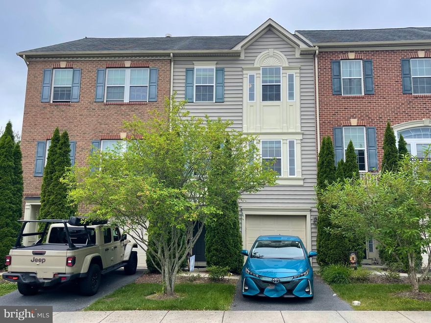 Spacious garage townhouse in sought after community to Villages of Urbana.  Entrance level with a large recreation room and half bath.  Main level with kitchen, dining and living area.  Hardwood floors, upgraded kitchen with granite countertop, stainless steel appliances.  Step out kitchen on to maintenance free deck backs to fenced yard with green views.  The community has a water park with water slides, lazy river and fountains. Other community amenities include : library, 3 pools, large indoor gym and sports barn (basketball/badminton/pickleball/volleyball), outdoor tennis/basketball courts, grocery, restaurants, medical offices, playgrounds, walking trails throughout the community. A new YMCA with a large aquatic center, before/after school programs etc.. Minutes to I-270. Urbana School district!