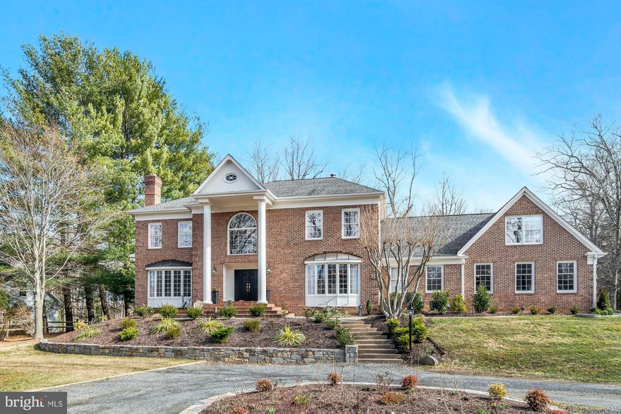 Elegant all brick colonial home  in Vienna’s MacDowell neighborhood. Sited on a private .87 acre lot with front yard views of a serene pond. The sun-filled interior boasts tons of recent upgrades, 5 bedrooms, 5.5 bathrooms, 3 car side-load garage and 7,403 finished square feet over three levels. An entertainer’s dream with an open floor plan, formal dining, butler’s pantry and living room. Bright gourmet kitchen with an island opens to the breakfast room. Inviting family room with a wet bar and a wood fireplace. Main level with an activity room, private home office with wood fireplace, laundry room and full bath. Luxury owner’s suite with a dressing room, private balcony, custom walk-in closet and spa-like en suite bath. Three additional bedrooms, one en suite bath and a Jack and Jill bath on the upper level. Spacious bonus room with built-ins and a wet bar. Finished lower level walks-out and boasts a recreation, wood fireplace, wet bar, den, 5th bedroom and full bath. Enjoy outdoor living on the deck, patio and expansive landscaped back yard. Amazing Vienna location convenient to Wolf Trap, downtown Vienna restaurants, shopping, and commuter routes. Within the top rated Marshall pyramid.