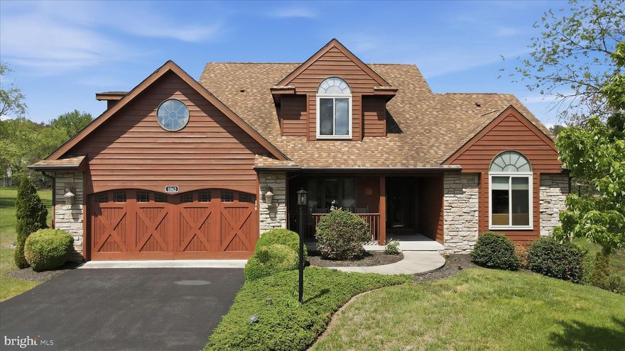 Exceptional craftsmanship and luxury details define this stunning 3-level home, beautifully positioned on the golf course with striking cedar lap siding and stone-accented exterior. A welcoming 2-car garage with carriage-style doors enhances the home’s timeless curb appeal.

The main level showcases an impressive great room anchored by a floor-to-ceiling stone gas fireplace, creating a warm and inviting space for both everyday living and entertaining. The open layout enhances the home’s livability while maintaining a refined, upscale feel.

The primary suite is truly unforgettable—designed as a private retreat featuring its own stone-accented fireplace and a spa-inspired bath with a large jetted tub and a dual-sided fireplace, perfectly positioned to be enjoyed from both the bedroom and bath for a truly relaxing experience. The expansive walk-in closet functions more like a luxurious dressing room.

The kitchen is beautifully appointed with new stainless steel appliances and sleek Silestone countertops, which continue into the bathrooms for a cohesive, upscale finish. Solid wood doors and heated tile flooring throughout the home add an extra layer of quality and comfort.

The lower level offers an exceptional extension of living space, featuring its own private secondary primary suite, complete with a full bath and a spacious family room area. A third fireplace with a charming wood mantel adds warmth and character, creating a cozy yet refined atmosphere. Designed with flexibility in mind, this level also includes a separate exterior entrance, making it ideal for guests, multi-generational living, or a private retreat—offering both comfort and independence within the home.

Outdoor living is just as impressive, featuring a spacious 12x24 screened porch with low-maintenance TimberTech decking—perfect for entertaining or relaxing. Below, a covered concrete patio provides even more functional outdoor space.

Perfectly positioned and beautifully appointed, this golf course retreat embodies elevated living—where luxury, comfort, and thoughtful design come together effortlessly.