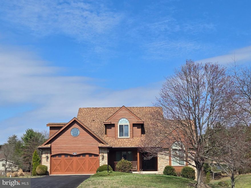 Exceptional craftsmanship and luxury details define this stunning 3-level home, beautifully positioned on the golf course with striking cedar lap siding and stone-accented exterior. A welcoming 2-car garage with carriage-style doors enhances the home’s timeless curb appeal.

The main level showcases an impressive great room anchored by a floor-to-ceiling stone gas fireplace, creating a warm and inviting space for both everyday living and entertaining. The open layout enhances the home’s livability while maintaining a refined, upscale feel.

The primary suite is truly unforgettable—designed as a private retreat featuring its own stone-accented fireplace and a spa-inspired bath with a large jetted tub and a dual-sided fireplace, perfectly positioned to be enjoyed from both the bedroom and bath for a truly relaxing experience. The expansive walk-in closet functions more like a luxurious dressing room.

The kitchen is beautifully appointed with new stainless steel appliances and sleek Silestone countertops, which continue into the bathrooms for a cohesive, upscale finish. Solid wood doors and heated tile flooring throughout the home add an extra layer of quality and comfort.

The lower level offers an exceptional extension of living space, featuring its own private secondary primary suite, complete with a full bath and a spacious family room area. A third fireplace with a charming wood mantel adds warmth and character, creating a cozy yet refined atmosphere. Designed with flexibility in mind, this level also includes a separate exterior entrance, making it ideal for guests, multi-generational living, or a private retreat—offering both comfort and independence within the home.

Outdoor living is just as impressive, featuring a spacious 12x24 screened porch with low-maintenance TimberTech decking—perfect for entertaining or relaxing. Below, a covered concrete patio provides even more functional outdoor space.

Perfectly positioned and beautifully appointed, this golf course retreat embodies elevated living—where luxury, comfort, and thoughtful design come together effortlessly.