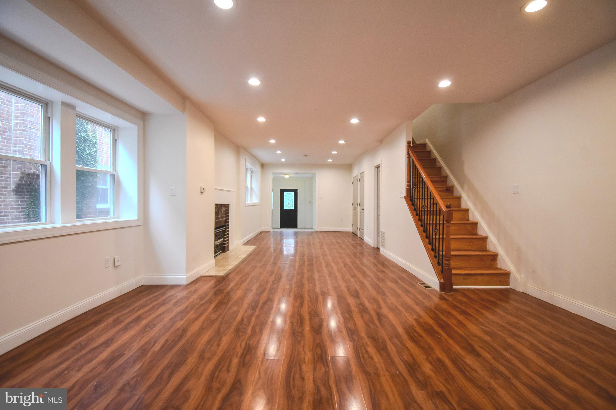Welcome to 6230 Carpenter Street — a large, move-in ready 4 bedroom home w/ garage parking, nestled on a tree-lined block in the heart of Cobbs Creek. This spacious twin has been thoughtfully updated throughout, adding modern conveniences to a character rich floorplan. The charm begins outside where a cozy front garden leads you to the home’s entrance. Step inside to find a spacious covered porch/mudroom—perfect for storing coats and shoes out of sight or enjoying a morning coffee. The expansive living room is highlighted by a decorative gas fireplace, a convenient powder room, two large closets and recessed lighting. Continue on to the fully equipped kitchen, featuring 42" cabinets, granite countertops, and stainless steel appliances including a dishwasher and over-the-range microwave. Adjacent to the kitchen, you'll find a bright breakfast room, ideal for casual meals or extra pantry storage. Upstairs, the second floor features three generously sized bedrooms, a dedicated laundry area, and a full bathroom with a dual vanity and a jacuzzi jet tub. Continue to the third floor, entirely dedicated to the primary suite. This level boasts a large walk-in closet and an en-suite bath complete with a dual vanity, a jacuzzi tub, and a separate shower with a frameless glass door. Throughout the home, an abundance of windows fills every room with natural light, including the partially finished basement with two separate walk outs. The rear of the property provides convenient garage parking for one car and driveway parking for another – a rare find in the city. Located just steps away from the expansive Cobbs Creek Park; a vast green space for recreation, trails, tennis and basketball courts, and a children’s playground, this home offers suburban tranquility in vibrant West Philly.