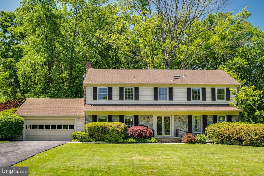 Great opportunity to live in desirable community of Flower Valley! This 4 bedroom 2.5 bath Colonial home with 2 car garage has many lovely features including: * large vaulted ceiling Screened-in porch is a little piece of paradise; * stone-faced wood burning fireplace in Family Room; * Spacious Primary Suite with Sitting Room (potential 5th bedroom) and Dressing Area; * hardwood flooring through most living areas; * large level yard with plenty of shade trees; * updated roof; * tons of storage…and a location that can't be beat: just blocks from Flower Valley Elementary School & pool, Rock Creek Park and Flower Valley Park, just moments to Safeway & restaurants, and a short drive to Metrorail Redline, downtown Rockville & more.  The home boasts lovely curb appeal with a stone and siding front, porch roof overhang, a wide flagstone walkway and porch leading to double door front entrance. The large reception Foyer has chair rail and shadow box molding and tile flooring.  The adjacent Living Room has hardwoods and looks out over the front yard.  A large cased-opening leads to the spacious Dining Room with chair rail and shadow box molding, and hardwood floors. The bright Kitchen has recessed lighting, 42-inch white cabinets, Corian counters, tile backsplash, and open shelving over peninsula counter.  The generous Breakfast Area has a full-sized bay window, a built-in glass front china cabinet and a deep double door pantry.  The adjacent Family Room has a dramatic stone-face wood burning fireplace with raised flagstone hearth and full wall mantle with Pecky Cypress wood paneling above, hardwood flooring, recessed lighting, and ceiling fan.  The convenient Powder Room can be accessed through a short hall from the Reception Foyer and the Family Room, and features a ceramic tile floor, alongside the Coat closet.  At the end of this short hall is the Office which has views overlooking the front lawn and provides handy access to garage.  On the other side of the Family Room are double French doors leading to the screened in porch with vaulted ceiling, 4 skylights, and ceiling fan, affording the perfect opportunity to enjoy the spacious level rear yard, and the mature landscaping throughout the property.  Carpeted steps (with hardwood underneath) with oak banister leading to upper level continue the chair rail and shadow box molding.  Decorative molding greets you on the double door entry to Primary Suite which features a closet at the entrance, hardwood flooring, and a ceiling fan.  The comfortable connected Sitting Room with hardwood floors also offers separate access to hall.  In the large dressing area to the right, there is a double door closet and an exterior sink & vanity leading to the en suite.  The updated en suite features an interior sink & cultured marble vanity, ceramic tile flooring, glass door shower enclosure with seat and decorative tile inset, and bright skylight.  The full bath on the hall has ceramic tile flooring, cultured tile double sink vanity, large mirror, fully tiled tub/shower, and an additional linen closet with shelving.  Bedrooms 2, 3 and 4 have hardwood flooring and the 4th offers double closets.  The unfinished lower level has Bilco stairs and door leading to rear yard, Trane XV80 gas furnace, AO Smith Signature Select gas water heater, and the washer, dryer, and utility sink round out the lower-level fixtures.