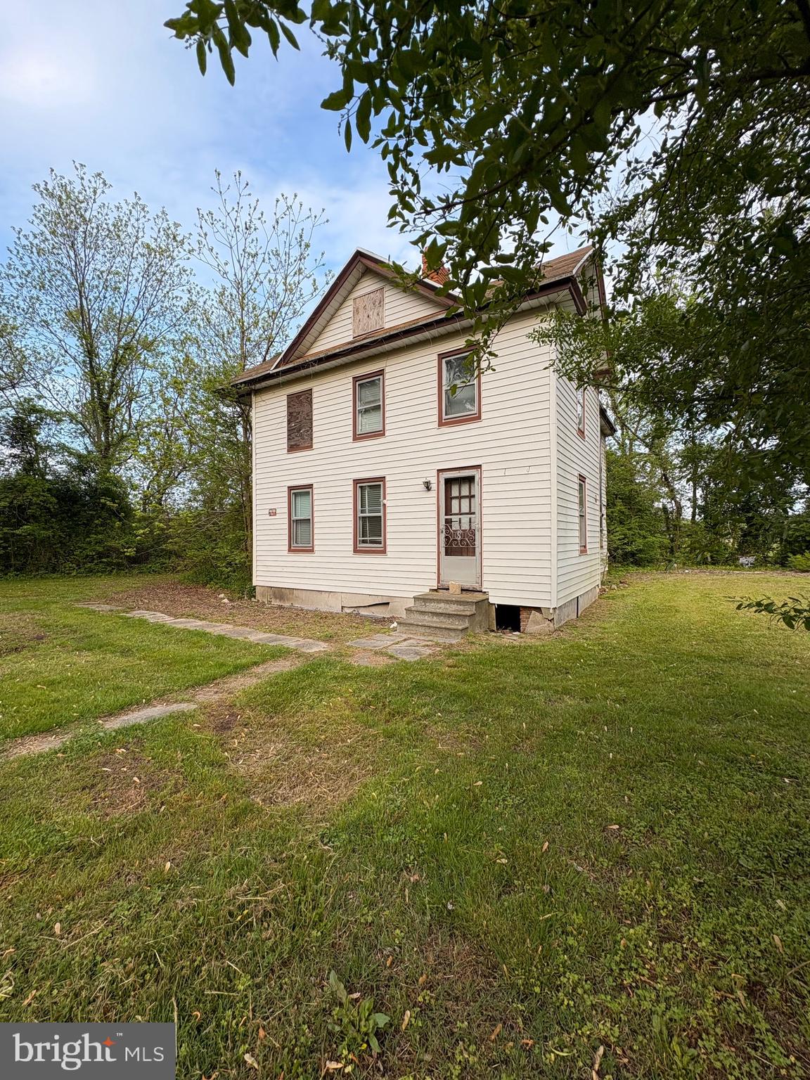 This historic property, which has been in the same family since the 1800s, boasts a large, octagon-shaped formal living area, original hardwood floors, intricate moldings, and hand-carved stair rails by the original owner, J. Fletcher Sterling, affectionately known as the “Strawberry King” by the locals. However, the home requires major renovations throughout. Some structural damage in one room, no kitchen or bathroom. The house is situated on a spacious, shady corner lot, surrounded by beautiful, mature trees.