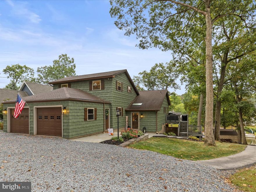 Welcome to Your Dream Lakefront Home in Lake Meade!

Experience the ultimate in lakefront living with this stunning move-in ready residence situated on a rare double lot, nearly an acre of beautifully landscaped privacy. Boasting over 3,400 square feet of elegant living space, this home offers the perfect blend of luxury, comfort, and breathtaking natural surroundings.

Inside, you’ll find a bright and open-concept layout with soaring vaulted ceilings and panoramic lake views. The gourmet kitchen features modern appliances, a large center island, and ample cabinetry—ideal for both everyday living and entertaining. The spacious living room flows seamlessly from the kitchen, creating a welcoming space for gatherings or relaxing by the water.

With five generously sized bedrooms and three full bathrooms, there’s plenty of space for family, guests, or a home office. The walk-out basement includes a full kitchen, full bathroom, and private bedroom—perfect for in-law quarters, guest accommodations, or a separate living space.

Step outside to an expansive deck and patio, complete with a brand new hot tub, perfect for soaking in the serene lake views. Head down to your private dock with a new boat lift, ready for boating, fishing, swimming, or unwinding at sunset.

Located in a quiet, gated community, yet just minutes from shopping, dining, and top-rated schools, this one-of-a-kind lakefront home offers the rare combination of space, privacy, and convenience.