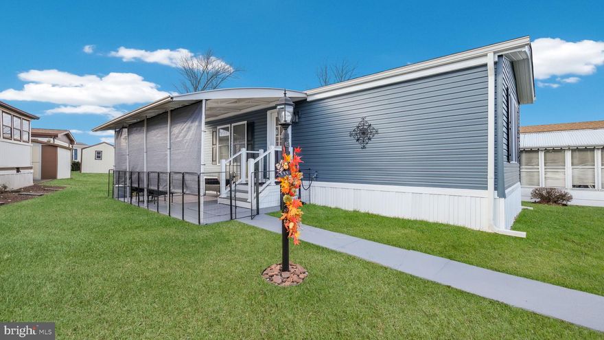 Welcome to this beautifully updated two-bedroom, two-bath home that’s truly move-in ready. Fully refurbished from top to bottom, this home offers modern features, quality upgrades, and comfortable living throughout. It has been professionally re-leveled and includes new drywall, insulation, PVC plumbing, vinyl siding, and a long-lasting 25-year shingle roof—helping keep energy costs down and maintenance worries away.

You’ll love the convenience of parking right outside your home and relaxing on the spacious covered patio, perfect for entertaining or enjoying cozy fall evenings. Trex steps lead into a bright, open living room with recessed lighting, a coat closet, and easy-care vinyl flooring.

The inviting eat-in kitchen is designed for everyday living and entertaining, featuring stainless-steel appliances, granite countertops, a deep sink with a stylish backsplash, a gooseneck faucet, and a skylight that fills the space with natural light. A brand-new washer and dryer are conveniently located in the kitchen, along with a large pantry and a second entrance for added accessibility.

The two bedrooms are located on opposite sides of the home for privacy and comfort. Each bedroom includes new carpeting, organized closets, and its own ensuite bathroom with tiled floors, tiled shower stalls, and modern vanities.

Outside, enjoy a freshly improved yard with newly graded and seeded landscaping, a freshly painted shed and garden box, and new stonework around the shed, AC unit, and back stairs. The heater and air conditioner have been fully serviced, all air vents professionally cleaned, and a new sliding screen door installed. The home also includes 12 total tie-downs for added stability.

This thoughtfully upgraded home offers comfort, style, and peace of mind—ready for you to move in and enjoy!

A host  of amenities awaits  your enjoyment included in the monthly ground rent such as a new clubhouse and a community pool perfect for relaxation and socializing with neighbors. Trash, sewer, common area snow removal, bus shuttle to local markets also included along with many other wonderful activities.

Don’t miss your chance to own this fabulous home!