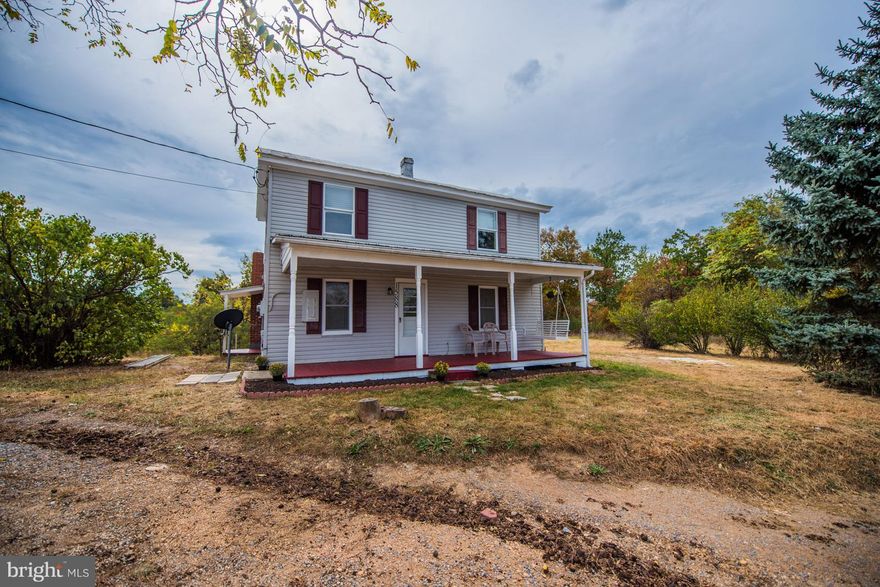 This newly renovated 1900 farm house sits on 3 acres just 1.5 miles from town. Has lots of yard and nice front porch to relax and enjoy the views.All newly painted inside with either new floors or newly finished floors. New stove and refrigerator in kitchen, refinished counters and cabinets and spacious laundry room off the kitchen,  Bedroom and bath on the main level. This is a charmer.