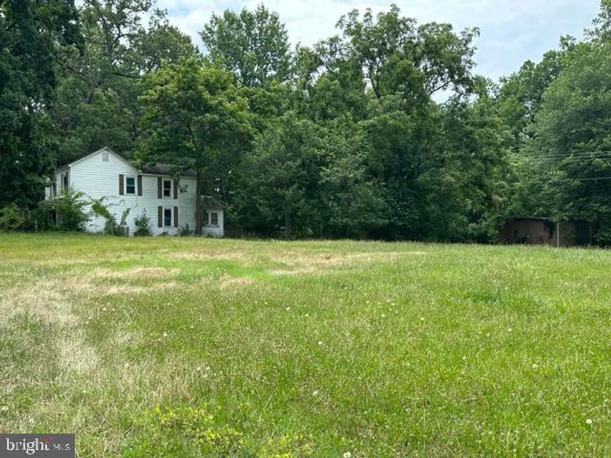 This home is being sold AS IS. This two-acre parcel is mostly open with nice shade trees.  Located at the intersection of Brock Road & Hancock Rd.  THIS  HOME IS A TWO-STORY, 2 BR,1.5 BATHS. LARGE 400-600 SQUARE FT OUTBUILDING WITH ELECTRIC. Agents- Read Private Remarks.