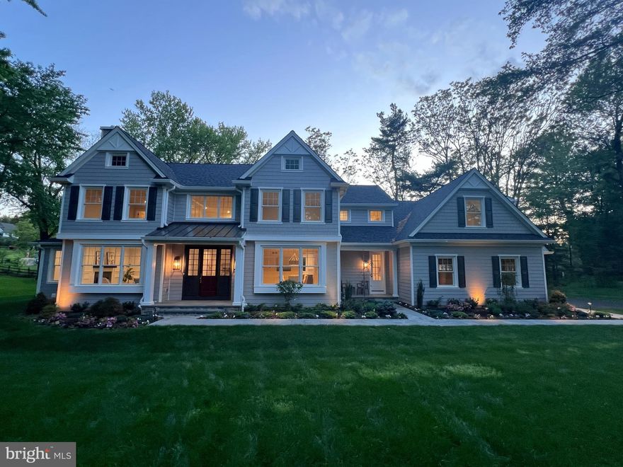 Construction is complete on this Custom new home by one of the Main Line's most respected custom home builders, John Rayer & Son Builders. This stately 5-bedroom, 6-bathroom residence is a masterful blending of classic style and state-of-the-art design. The home seamlessly combines storied architectural detail with the cutting-edge features and finishes expected by today's discerning buyer. With its long drive way, and on a completely private, fully landscaped lot with irrigation system and landscape lighting, the property offers a serene oasis in a popular Lower Merion neighborhood. The elegant custom design extends from the natural Pennsylvania flagstone walkway and solid mahogany front door to the oversized rear patio. The interior of the home is a testament to quality craftsmanship. Elevated features include 8-inch-wide plank natural white oak flooring, custom crown molding and paneling and solid white oak railings. The floor plan impresses with ample formal and casual spaces, front and back staircases, two powder rooms on the first floor, huge kitchen/great room and a large mudroom with built-in cubbies. The Gourmet Chef's Kitchen is equipped with top-of-the-line Thermador appliances, including a 48” range, double steam wall ovens, two sinks and more. Two fireplaces with stone surrounds adorn both the family and living rooms. The home features an eye catching professional wine cellar, appointed with a slate floor and cedar shelving, and maintained by a top-of-the-line WhisperKool cooling system; it sits just off the dining room on the main level. The luxurious Primary Suite is a spacious retreat with a massive custom closet by Topshelf Closets and a spa-like primary bath featuring Carrara marble floors and Brizo plumbing fixtures.  The huge lower level has 9-foot ceilings and provides an additional 2,294 sq ft of space that could be customized to meet many needs.  This property is located in the top-rated Lower Merion School District just a 20-minute commute to Center City Philadelphia and leaves nothing to be desired.