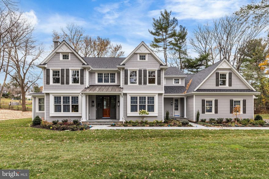 Construction is complete on this Custom new home by one of the Main Line's most respected custom home builders, John Rayer & Son Builders. This stately 5-bedroom, 6-bathroom residence is a masterful blending of classic style and state-of-the-art design. The home seamlessly combines storied architectural detail with the cutting-edge features and finishes expected by today's discerning buyer. With its long drive way, and on a completely private, fully landscaped lot with irrigation system and landscape lighting, the property offers a serene oasis in a popular Lower Merion neighborhood. The elegant custom design extends from the natural Pennsylvania flagstone walkway and solid mahogany front door to the oversized rear patio. The interior of the home is a testament to quality craftsmanship. Elevated features include 8-inch-wide plank natural white oak flooring, custom crown molding and paneling and solid white oak railings. The floor plan impresses with ample formal and casual spaces, front and back staircases, two powder rooms on the first floor, huge kitchen/great room and a large mudroom with built-in cubbies. The Gourmet Chef's Kitchen is equipped with top-of-the-line Thermador appliances, including a 48” range, double steam wall ovens, two sinks and more. Two fireplaces with stone surrounds adorn both the family and living rooms. The home features an eye catching professional wine cellar, appointed with a slate floor and cedar shelving, and maintained by a top-of-the-line WhisperKool cooling system; it sits just off the dining room on the main level. The luxurious Primary Suite is a spacious retreat with a massive custom closet by Topshelf Closets and a spa-like primary bath featuring Carrara marble floors and Brizo plumbing fixtures.  The huge lower level has 9-foot ceilings and provides an additional 2,294 sq ft of space that could be customized to meet many needs.  This property is located in the top-rated Lower Merion School District just a 20-minute commute to Center City Philadelphia and leaves nothing to be desired.