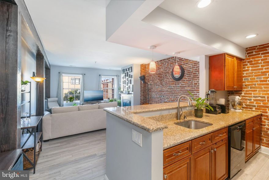 Major Renovation in 2021! This beautiful Old City Condo boasts a modern interior, recently updated with cherry cabinets, granite countertops, contemporary lighting, and new LVP floors. Large windows, lofty 12-foot ceilings, a spacious walk-in closet, a modern tile bathroom, and an in-unit stackable washer and dryer complete the space. In the 902-square-foot open floor plan, you'll find an open floor plan living and dining area with a cozy woodburning fireplace and an exposed brick wall. This 1-bedroom 1-bathroom unit is situated in the Historic Old City River Church condominium building, offering a fantastic location close to a wealth of amenities. You'll be within walking distance of theaters, restaurants, galleries, shopping, and more, with Center City just a 5-minute drive away. Access to the unit is secure, with a vestibule featuring security access and a well-maintained common mail area. This condo is on the 4th floor on the West side of the building. This orientation shields the unit from the noise of 95 as well and provides fantastic natural light.  Small dogs are welcome.