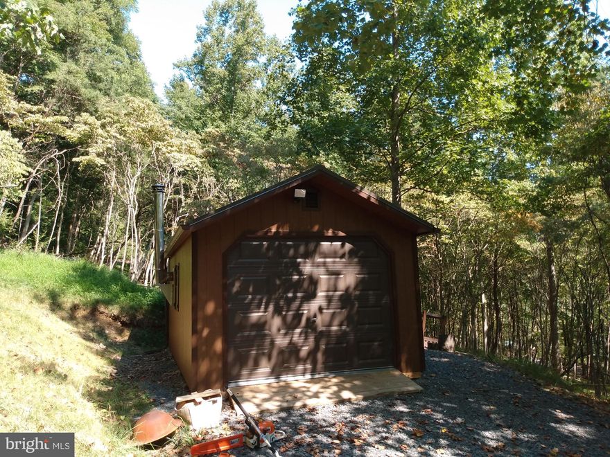 10.91 wooded acres improved with 12 x 20 cabin shed the drive way in place. This property is river front with the added challenge of traversing a steep grade to access it, but beautiful when you get down to it.