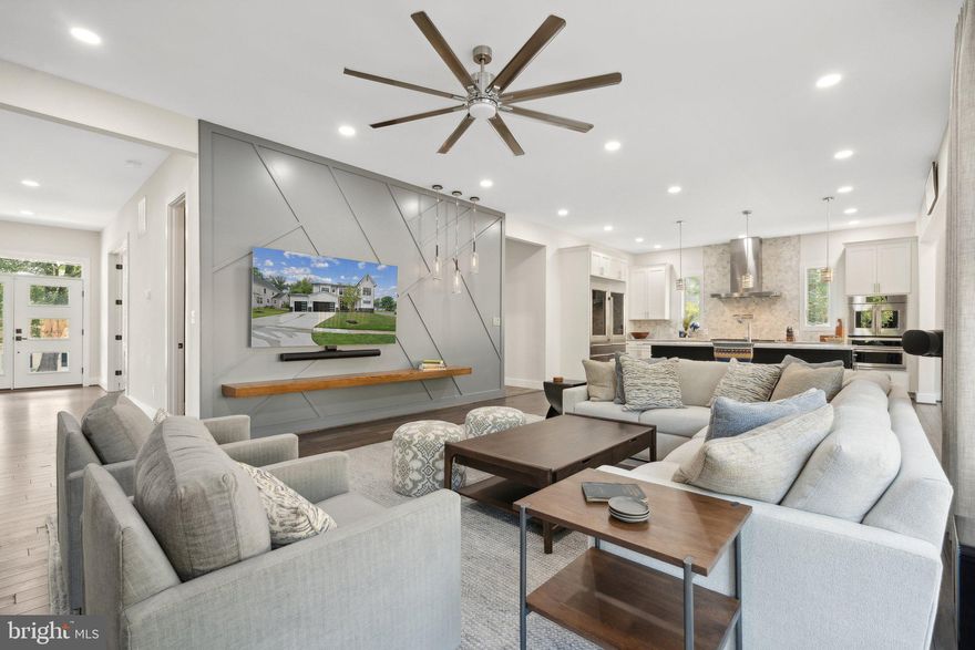 When this home was built two years ago, the Modern Farmhouse look was right out of the pages of a Luxury Living magazine. This house belongs in one of those magazines, thanks to the architect and builder’s attention to design and detail, and the work that the owners have done to transform this beautiful house into a beautiful home. Over $65,000 in upgrades include high-end window coverings and electronic blinds, built-ins in the mudroom and in the Primary Suite’s walk-in closets, updated light fixtures, wall paper and the great room’s wood-relief feature wall. The house came with top-of-the line appliances, a double fridge/freezer in the gourmet kitchen, a pantry extraordinaire complete with a beverage center, honed stone countertops throughout, scraped 4" plank wood floors on the two top floors, two laundry rooms, an elevator, a basement built for entertaining, a three-car garage that has wiring for a car charging station, a deck with a gas line to the grill and the smoker (both of which convey) AND a screened  porch. The main level offers a wonderful open floor plan, anchored by an office and a formal parlor/sitting room/music room/den... whatever you want it to be. One of two laundry rooms is in the mudroom, just off of the modern farmhouse kitchen. Upstairs, or up the elevator, is the Primary Suite that includes two walk-in closets, a beautifully appointed bathroom and the perfect adjacent room that can be a nursery, den, office, yoga/meditation room - this extra space makes the Primary Suite a true retreat. There are three additional bedrooms, bathrooms and the second laundry room on this floor. Taking the elevator all the way down, the basement is a wonderful entertainment oasis. The pool table conveys, the bar is well-appointed with a beverage center and a dishwasher, the guest suite is large and has a beautiful bathroom, and the sixth bedroom is currently the perfect gym. Inside this beautifully appointed home you are isolated from the world, yet outside, you are so close to everything. In the neighborhood, this home is just a stone's throw from Olney Park and a few blocks from Pimmit Park. While the back yard is a smaller footprint, having Olney Park with all of its facilities (playground, basketball court, baseball, tennis, trails, picnic shelter) and plenty of grass basically around the corner will give you your weekends back. You won't have to spend your weekend mowing, weeding or raking, you can be playing instead! And right outside the neighborhood is some of the best that the DMV has to offer. Situated in a cozy neighborhood that is smack dab in the middle of everything, including grocery stores, shops, restaurants, bars and entertainment venues.  Situated inside the Beltway between the City of Falls Church and Tysons, this location is also equidistant to McLean and West Falls Church metro stations (@1.2 miles to each of them), with easy access to most of the major commuting arteries. It is also in the sought after Marshall High School pyramid, you have time to get settled before the new school year starts! Don't miss viewing the Virtual Tour and the 3D Matterport Tour. (There is a video doorbell and the security system has video cameras).