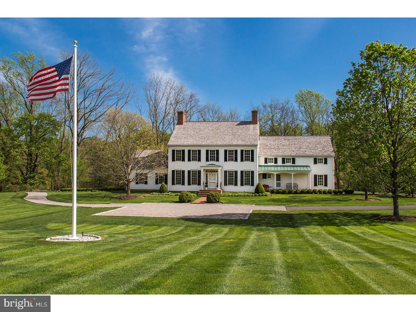 In one of the most special settings in Bucks County, on 34+ acres sweeping acres on Meetinghouse Rd., this gorgeous estate backs to a beautiful surprise. Behind this expanded & totally renovated home is a shimmering, 6-acre lake, known as Honey Hollow Pond! This classic home showcases French doors & tall windows to capture views of the water & wide open vistas. Over the past several years, the beautifully designed home, originally designed by Lynn Taylor & built by Jarrett-Vaughan, has been enhanced in the best of ways, using the same talents! The 4 Bedroom, 4.2 bath home is finished on the outside w/all natural materials ? wood clapboard siding, newer cedar shake roof, brick & stone terraces appointments, & working wooden shutters. The interior offers gleaming wide board mahogany flooring t/o, large scale mill work, raised paneling, chair & crown molding, deep sill windows, 10 ft. first floor ceiling height, extra tall interior doors, main & secondary staircases & entries, 5 fireplaces, & all en-suite bedrooms! A formal entrance foyer w/ beautifully designed stairwell is flanked by a library w/ built-ins, & a formal dining room, each w/a corner fireplace. Beyond is a large great room w/full wall of French doors, leading to a brick terrace & offering extraordinary water views. The completely renovated kitchen has classic white cabinetry, honed granite counters, Wolf, Subzero & Miele appliances; it leads to a fabulous new library w/ fireplace, window surround & glorious views. Enter the newly expanded 1st floor main bedroom suite via a private hallway, complete with sitting alcove, fireplace, vaulted ceiling w/beam detailing, two w/in closets w/closet systems, and 1-1/2 new baths outfitted w/custom white cabinetry, Carrara marble counters & floors, marble shower & radiant heat. Upstairs, a large gallery lounge has custom built-ins, a perfect reading area. Three bedrooms enjoy private baths, two of which are brand new! Additional conveniences include a first floor laundry, renovated powder room, ample closet space, and access to an attached two-car garage. The grounds include a meetinghouse-style four-car garage w/barn doors & concrete floors & 5-stall barn with heated tack room & powder room, all in mint condition. Steps to the spectacular lake provide access for fishing or canoeing, and fenced boxed gardens allow for growing herbs, vegetables or flowers! This estate is beyond sensational- the perfect address in Bucks County's most exclusive valley!