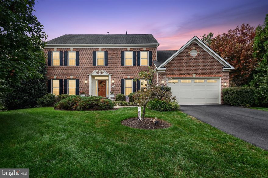 Welcome to this beautiful brick colonial home sitting atop a private 1.1 acre lot! 1126 Stuart Hills Way features comfortable and functional living and incredible sunset views from your private deck. This immaculate home boasts 5 bedrooms with an option for a 6th potential bedroom in the lower level, 4.5 bathrooms, and over 6K sqft. The grand  foyer welcomes you into this traditional main level which features a formal living room (currently used as a home office), formal dining room, and a dramatic 2 story, open great room overlooking the lovely backyard. The kitchen is delightful with ample cabinetry, stainless steel appliances, double wall oven and a gas range. Entertaining is made easy with plenty of space on the island or eat-in area, or head outdoors to dine al fresco on the spacious deck, complete with an electric awning. A main level bedroom, powder room, laundry room and mudroom round out this level. Up the staircase and aside from the dramatic views below, you will find a generous-sized master retreat compete with a large, bright ensuite bathroom, and a very functional walk-in closet. Head down the hall to another bedroom with an ensuite bathroom, and 2 bedrooms sharing a "Jack and Jill' bathroom. Best of all is the incredible lower level/walk-out basement featuring versatility and functionality. The game room can easily be the perfect hang out space, or head over to the living room with a kitchenette and French doors leading out to a stone patio. The third living space was intended to easily transform into a 6th bedroom (just add framing and drywall!) with an ensuite bathroom, making it a perfect guest suite, in-law suite or AuPair Suite. In addition to all of this, there is a large utility room making storage plentiful in this home. 1126 Stuart Hills Way is truly a private oasis as you head outdoors to your newly fully fenced yard with meticulously maintained and mature landscaping and 3 outdoor living areas! Ideally located near shopping, dining, Reston Town Center, Dulles Airport, and more. No HOA fees. Home is more important than ever, and this one has it all!