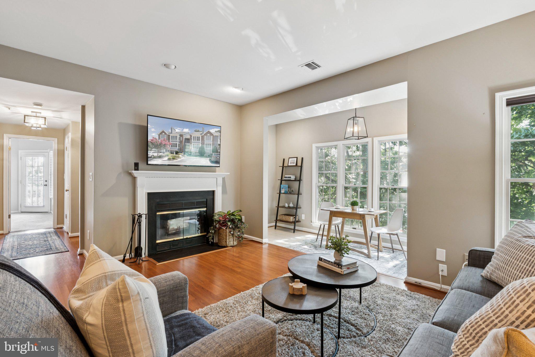 Welcome to The Villages at Summerplace, a serene and sought after enclave within the amenity rich Riva Trace community of Annapolis! This beautifully maintained condo offers a rare blend of privacy, nature views, and modern convenience, just minutes from downtown Annapolis, shopping, dining, medical facilities, and major commuter routes to Baltimore, Washington D.C., and Fort Meade.
Step inside to discover a bright and airy open layout featuring a spacious living room with a cozy wood-burning fireplace. The living area flows seamlessly into a sun-drenched sunroom, perfect for a sitting area, home office, or personal gym. Adjacent to the living room is a generous dining area and a tastefully updated kitchen with stainless steel appliances, counter seating, ideal for casual meals and entertaining.
Down the hall, you’ll find a full bathroom, a spacious guest bedroom, and a convenient, space-saving all-in-one washer and dryer. At the end of the hall, the expansive primary suite offers a walk-in closet and an en-suite bathroom featuring a double vanity and a walk-in shower. Step outside from the primary bedroom to your private covered balcony, an ideal place to enjoy morning coffee or unwind after a long day. Additional features include a secure, lockable storage bin in the building’s basement.
As a resident of Riva Trace, you’ll enjoy some of the area’s finest amenities, including private water access to Gingerville Creek and the South River via a community pier, canoe and kayak storage, scenic walking and hiking trails, tennis and pickleball courts, a basketball court, playground, picnic areas, and even a crabbing pier. The community’s natural beauty, quiet surroundings, and welcoming atmosphere make it one of Annapolis’ most desirable places to live.