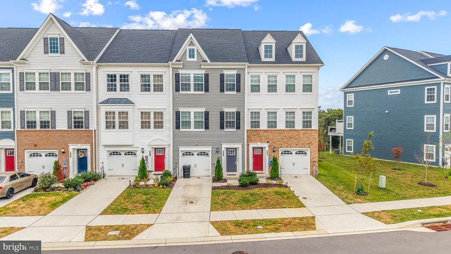 This four level, 4 bedroom, 4 bedroom home is located in the highly accessible Windsor Mill area and provides convenient access to Baltimore, Washington D.C., and major commuter routes including I-695, I-70, and I-95. The entry level features durable luxury vinyl plank flooring, a bedroom with direct backyard access, a full bathroom, and a storage area extending under the stairs—plus interior access from the garage for added practicality.

The main living level is also finished in luxury vinyl plank flooring and showcases an oversized kitchen island measuring more than eight feet, generous pantry and closet storage, and a half bath. This open-concept space offers flexibility for a dining area, while a large sliding door leads to a Trex deck with views of trees and a walking path. Updated stair treads with no carpeting provide a clean, contemporary look.

Upstairs, each bedroom includes custom built-in closet shelving. The primary suite features a tray ceiling, a spacious shower with built-in seating, an enclosed toilet room, and a dual-sink vanity. A dedicated laundry area with like-new appliances is also on this level for added convenience.

The fourth floor offers even more versatility with a private deck and a large attic-style space that can function as an office, playroom, or additional living area.
