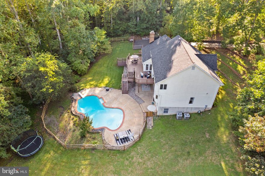 Come home to your personal PARADISE in Avalon Estates! Just minutes from Warrenton/Gainesville, this gem is tucked away on a cul-de-sac in the Kettle Run High School district. The interior is gorgeous, but the tree-lined 1.51 acre lot w/private pool is the property's show-stopper!  An entertainer's dream with multiple spaces to host inside and out!  And for those who prefer a quieter scene, this property is an oasis - listen to the birds while enjoying morning coffee & watch the sunrise over your deck, or cozy up by the woodburning fireplace in the cooler months. Other highlights include: Neutral paint and refinished hardwood floors on main level; fantastic blend of traditional & contemporary floor plan w/ separate living, dining, office and gathering spaces; Cheery kitchen w/ breakfast nook overlooking backyard; 4 Spacious upper level bedrooms, including a second en suite w/private bath and bonus room; Primary Suite has new LVP flooring, HUGE walk-in closet w/ Closets By Design system, updated vanity/lighting; the basement has tons of room to play or host w/ a 4th full bath, rec room, and still maintains some storage space; Rear yard is fenced (Aprl 2022); Deck cleaned and stained (Sept 2023); Distribution Box/Headers (2021); Roof (2018); HVAC (2015) No HOA. Serene and beautiful. A true DREAM home!