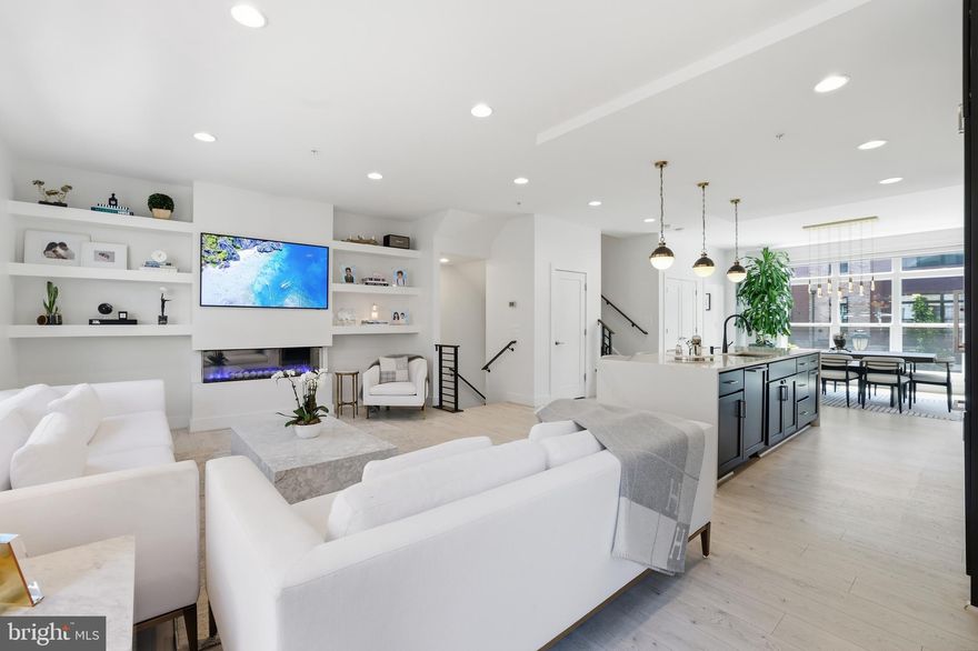 Welcome to this beautifully upgraded, sun-filled luxury end-unit townhome offering the perfect blend of modern elegance, comfort, and thoughtful custom design. Every detail of this home has been carefully curated to create a warm, inviting atmosphere that is both functional for everyday living and exceptional for entertaining.

With over $200k in premium upgrades and designer enhancements, this stunning residence features soaring 9.5-foot ceilings, abundant natural light throughout every level, and seamless open-concept living spaces designed for today’s lifestyle. The gourmet chef’s kitchen is a true centerpiece, showcasing top-tier cabinetry and appliances, Quartz countertops, an expansive waterfall island with abundant storage, upgraded tile backsplash, under-cabinet lighting, and a polished high-end feel throughout.

The home includes numerous custom upgrades that make it truly one of a kind, including a beautifully built-in fireplace with custom shelving and wallpaper, elegant bar cabinetry with antique mirrors, a second pantry for additional storage, customized his-and-her closets, mirrored closet doors with built-in mirrored accents, custom children’s bedroom closets, added rail shelving throughout all closets, and extensive garage shelving for optimal organization.

The loft level and outdoor spaces have also been thoughtfully enhanced with upgraded outdoor tile and pavement, creating the perfect retreat for relaxing or entertaining.

Sunlight pours through every level, creating a bright and welcoming ambiance you’ll love coming home to. Move-in ready with timeless finishes, refined details, and exceptional functionality, this home offers luxury living at its finest.

Residents enjoy access to exceptional community amenities, including pool, elegant clubhouse, state-of-the-art fitness center, yoga studio, beautifully landscaped gathering spaces with cozy firepits, BBQ areas, and meticulously maintained common areas — offering the perfect blend of luxury, convenience, and community right at your doorstep.

Complete with an oversized two-car garage and located in one of Rockville’s most desirable communities, this exceptional home is truly a rare opportunity.