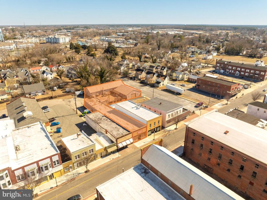 Introducing an opportunity at 518 Race St in Cambridge, MD. This 4,630 SF building, built in 1925, offers exceptional potential for retail and street retail users. Zoned Downtown/Waterfront Development District, it allows for a versatile amount of uses for commercial ventures. With a strategic location in the heart of Cambridge, this property provides large amounts of traffic with great visibility. 5+/- Parking spots are available for customer use, along with street parking. Central A/C & lighting were replaced in 2018, the roof was recoated with silicone in 2021, a window unit helps provide A/C to the warehouse portion of the building, which also contains an 8 ft roll up door, a 48" X 96" rear commercial entrance door, 12' ceilings throughout, along with one restroom. The property features an open layout, with two large showcase windows for advertisement. This property can also be purchased together with 522 Race St #Rear.  Deeded right a way to Muir Main. Front Room 96x25, Rear Storage 30x25, 1/2 bath 6x4, Way Back Storage 35x27. Overall Length 158x27+/-

522 Race St #REAR is a property consisting of 3 warehouse buildings in the heart of Cambridge, MD, these 3 buildings total up to 5456 SF offering versatile industrial warehouse space. The property was built in 1945. The first building is a block building (35' X 100') with two 12' roll up door, a ceiling height of 12',  floor drain, a bathroom, newly updated 200 Amp electrical services, LED lighting, and a new propane heater. Building two (37' X 50') has one 12' fiberglass roll up door, and electricity present but not connected. Building three (22' X 19') has a double door entrance, and can be used as additional storage. The parking lot is paved and fenced with 2 - 16' entrances with double 8' gates. This property can be purchased with 518 Race St. All offers are encouraged!
