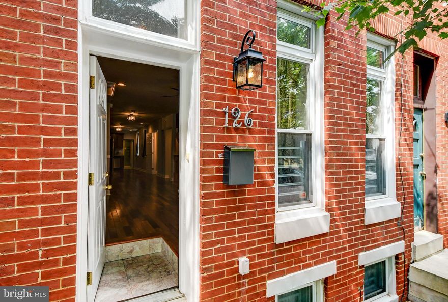 Perfect package on Butchers Hill for under $250,000!. This home has a wonderful, open layout with high ceilings and great functionality. Living, Dining and updated Kitchen are all open to one another. There is a man level powder room. A main level laundry room/pantry completes the main level in the rear of the home. Out back is a good size patio. Upstairs, you will find a light-filled primary bedroom with great closet space, 3 large windows, and a full bath in the front of the home, and a second bedroom and full hall bath in the rear of the home. Both bedrooms and bathrooms upstairs are spacious and in nice condition. The lower level is the entire footprint of the home, has good ceiling height and is fully finished into 2 spaces. It would be a great family/recreation room plus home office or third bedroom! Most of the home has gleaming hardwood floors and the lower level has neutral carpet. The main level has very nice crown and chair molding. The kitchen has stainless appliances, sturdy wood cabinets, and great space. This home is ideally located 2 blocks from Patterson Park, approximately 2 blocks from the Hopkins Hospital campus and Eager Park green space (and Starbucks). Located in the great community of Butchers Hill, home to 2 great restaurants- Charmed Kitchen and La Barrita, and a short walk to the new Ministry of Brewing and the amazing Water for Chocolate restaurant. Close to all major public transportation and walkable to downtown, Fells Point and Canton.