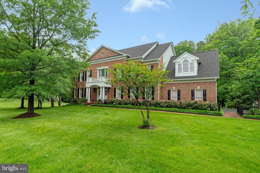 Impressive Craftmark brick colonial, set back from the street, on a generous half-acre lot, with 6BD, 7.5BA and an expansive 8,850 square feet of living space across four thoughtfully designed levels. Located within the sought-after Marshall High School pyramid, minutes to Silver Line metro, Tyson’s and major commuter routes.

The main level features hardwood floors throughout and a two-story foyer that leads to a stunning two-story great room with a gas fireplace and oversized windows with views of the tree-lined back yard. A main level ensuite bedroom, ideal for guests or multi-generational living, is nicely tucked away from other gathering spaces. The expansive kitchen with a large center island, breakfast bar and breakfast room offers plenty of seating for casual family meals and a great spot for crafts or homework! A separate dining and formal living room complete this level.

On the upper level are four well-proportioned ensuite bedrooms, each with walk-in closets, including the primary bedroom suite. This expansive owners’ suite features a separate sitting room, two walk-in closets, and a large bathroom with a relaxing soaking tub and a separate walk-in shower. The fourth level offers a unique loft space with an additional bedroom, a full bath, and a den, providing flexibility for various needs.

The walk-up lower level is designed for family fun and hosting friends, featuring a large recreation room, a game room with a bar, and a theater room for movie nights, and plenty of storage space for easy organizing.

The landscaped exterior, highlighted by a fabulous rose garden entrance, features mature shade trees, a large, usable backyard and a deck off the kitchen - ideal for recreation and relaxation. A three-car side-load garage, with Tesla charger, provides ample parking and storage. Roof and Water Heater - 1 year old. Public water and sewer.