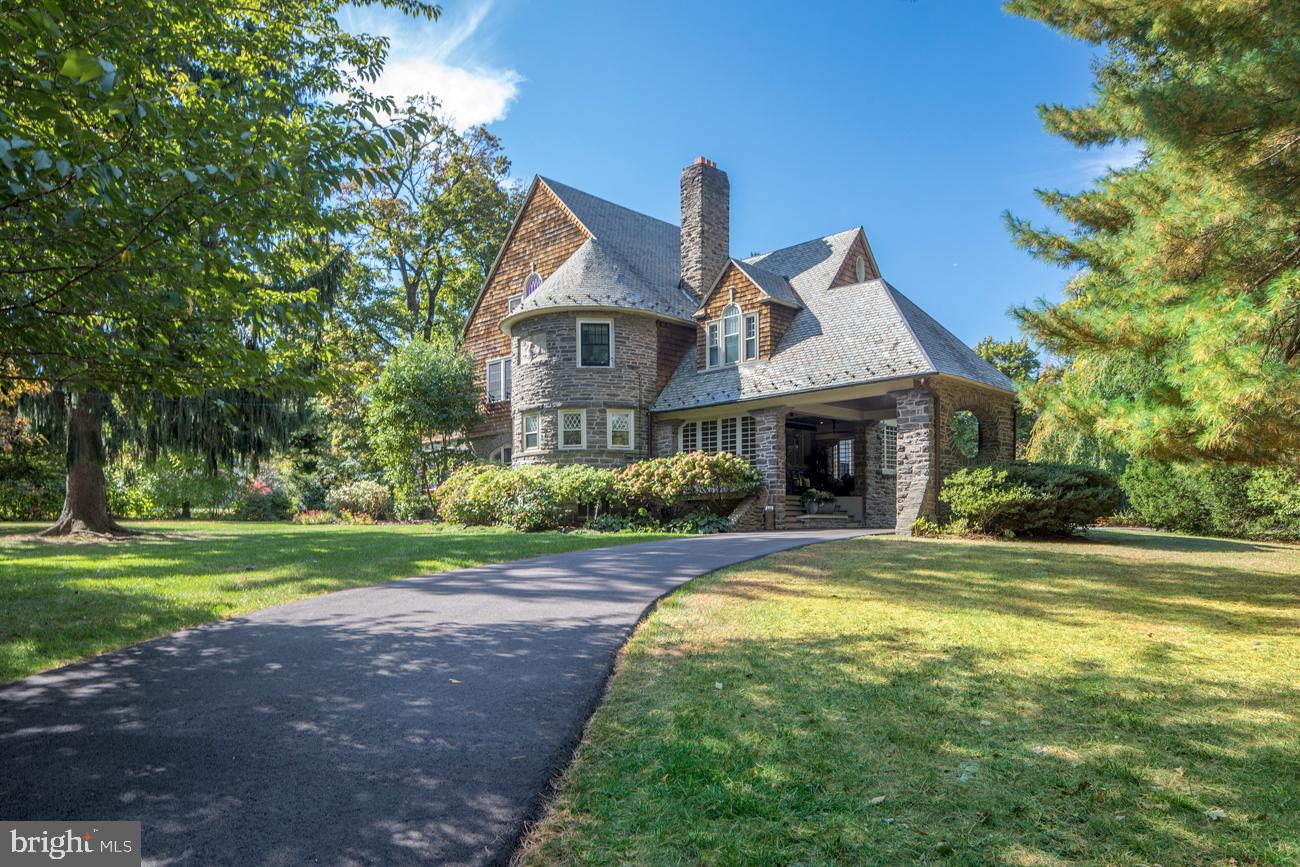 In-person showings available! Virtual tours are also available. Check out the 3-D Virtual Tour: https://my.matterport.com/show/?m=JEnv6gq56et&brand=0. Youtube Video Tour: https://www.youtube.com/watch?v=E-QhvfbJPOg&t. Virtual tours are available! Once known as a Tower House, this gem was Horace Trumbauer s first built home for Wendell & Smith in their Wayne development. It was completed in 1892 by one of the most prominent architects of the Gilded Age, who designed manors for the wealthy & later hotels, office buildings, the Philadelphia Art Museum & much of Duke University. The gorgeous, exceptionally unique home with a front turret & stone arched port-cochere is brimming with magnificent details & tastefully enhanced with over $400K in improvements. All in a prime walk-to-Wayne location, making it a truly prized property. Nestled on over an acre lush grounds, 314 Louella boasts curb appeal galore. The magical outdoor setting features a level lawn, stunning private yard, patio for entertaining & in-ground pool for summer pleasure. Mature landscaping was professionally planted to offer sequential blooming of cherry blossoms, dogwoods, hydrangeas, to name a few. New landscape lighting was installed in 2018, among it, LED lights for trees in the front lawn, to the stone pillars at the driveway entrance. The house is perfect for any family that wants to keep as-is, make minor updates, OR do a major addition (G/F sealed construction drawings, a $40K value, come with the sale). The original carriage house/garage, rebuilt in 1989, affords possibilities as an in-law suite, gym, office, etc. Expansion over the existing parking spaces in front of the basketball hoop can allow for 2 more garage spaces (for a total of 4) & additional living area above. Reinforced beams over the port-cochere enable versatility to create a sitting room, walk-in closet & bath as part of the adjacent BR atop the covered porch. The slate roof has been well maintained & improved with new snow guards, copper flashing, copper ridge capping, etc. Among other upgrades are a newly repaved driveway, new retaining wall & basketball hoop (2019), all new mechanicals under 5 years old including HVAC, steam boiler heat & HW heater, whole house rewiring, refinished wood floors, an expanded master suite & laundry room, and new marble master bath with heated floors, his/her vanities, pedestal tub & shower with Bluetooth speaker & electronic controls for 6 heads. Relax with family & guests in the large kitchen with a glass breakfast area & spacious dining room. Watch movies in the family room/den with cozy heated floors. Bright, generously-proportioned rooms include 5 bedrooms & 4.5 baths. Sip wine & chat on the lovely front porch. Enjoy warm days & evenings in the rear yard, deck & pool. Cheer the kids playing sports on the lawn & basketball court. The perks continue with an unbeatable location, 4 blocks to the center of Wayne, in the top-ranked Radnor school district, near major highways, shops, restaurants, the train to Center City & much more.