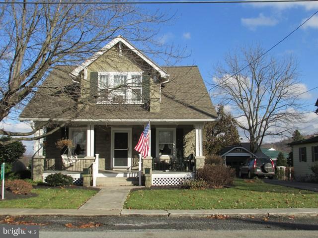 Very well kept 1 1/2 story home on a .32 acre landscaped lot. Detached 1 car garage plus a detached 2+ car garage w/15'x27' shop. 1st floor den/office area, 2nd floor 7'x9' room could be nursery. 2 year old roof, upgraded 200 amp electric, 3 window AC units stay! Note: access to garage/shop through fire company lot by verbal agreement.